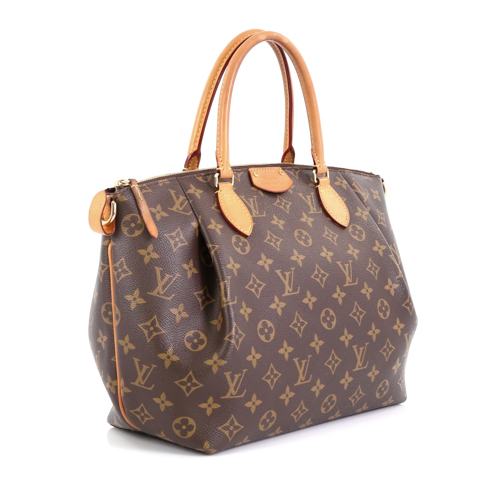 This Louis Vuitton Turenne Handbag Monogram Canvas MM, crafted in brown monogram coated canvas, features dual rolled leather handles and gold-tone hardware. Its zip closure opens to a purple fabric interior with slip pockets. Authenticity code