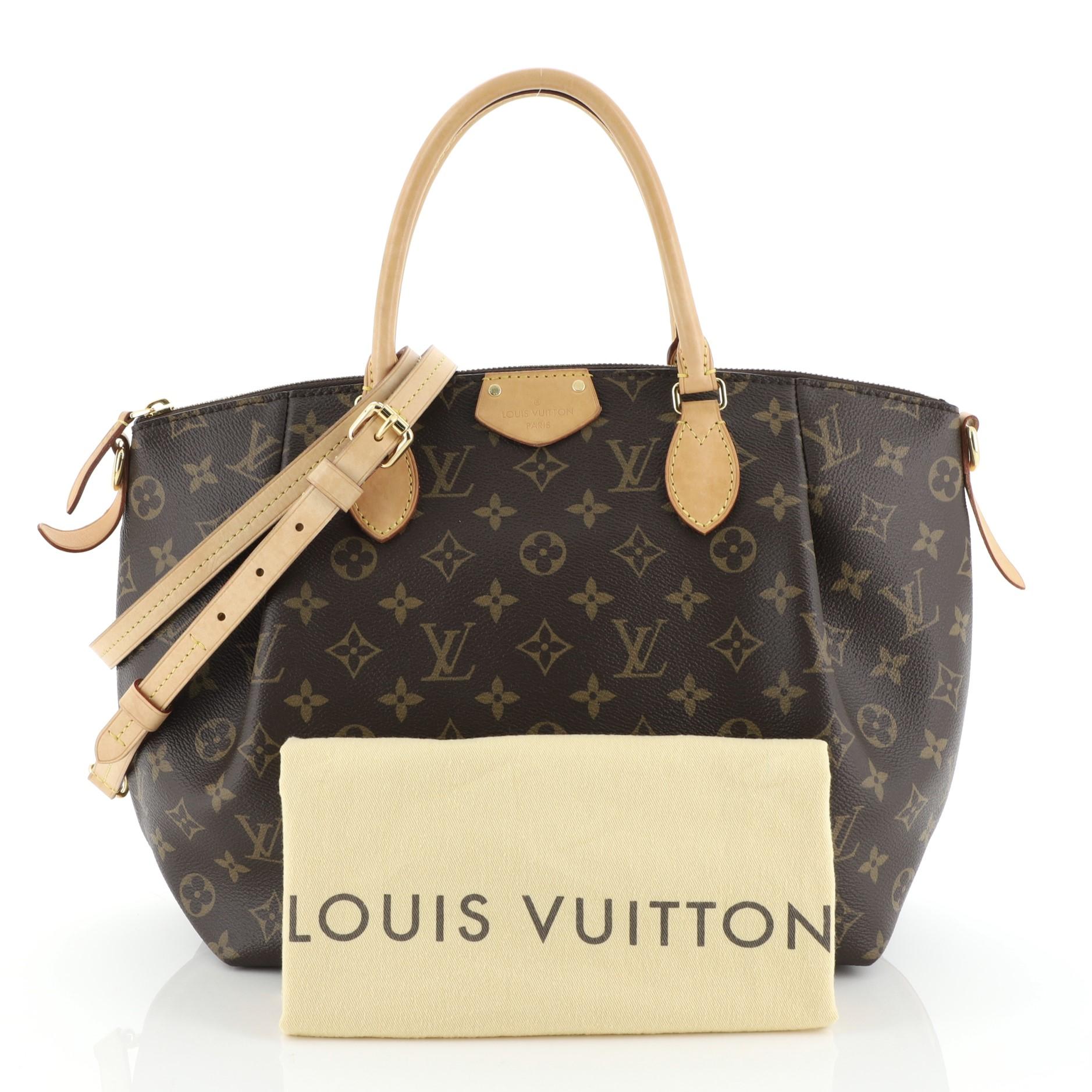 This Louis Vuitton Turenne Handbag Monogram Canvas MM, crafted in brown monogram coated canvas, features dual rolled leather handles and gold-tone hardware. Its zip closure opens to a purple fabric interior with slip pockets. Authenticity code