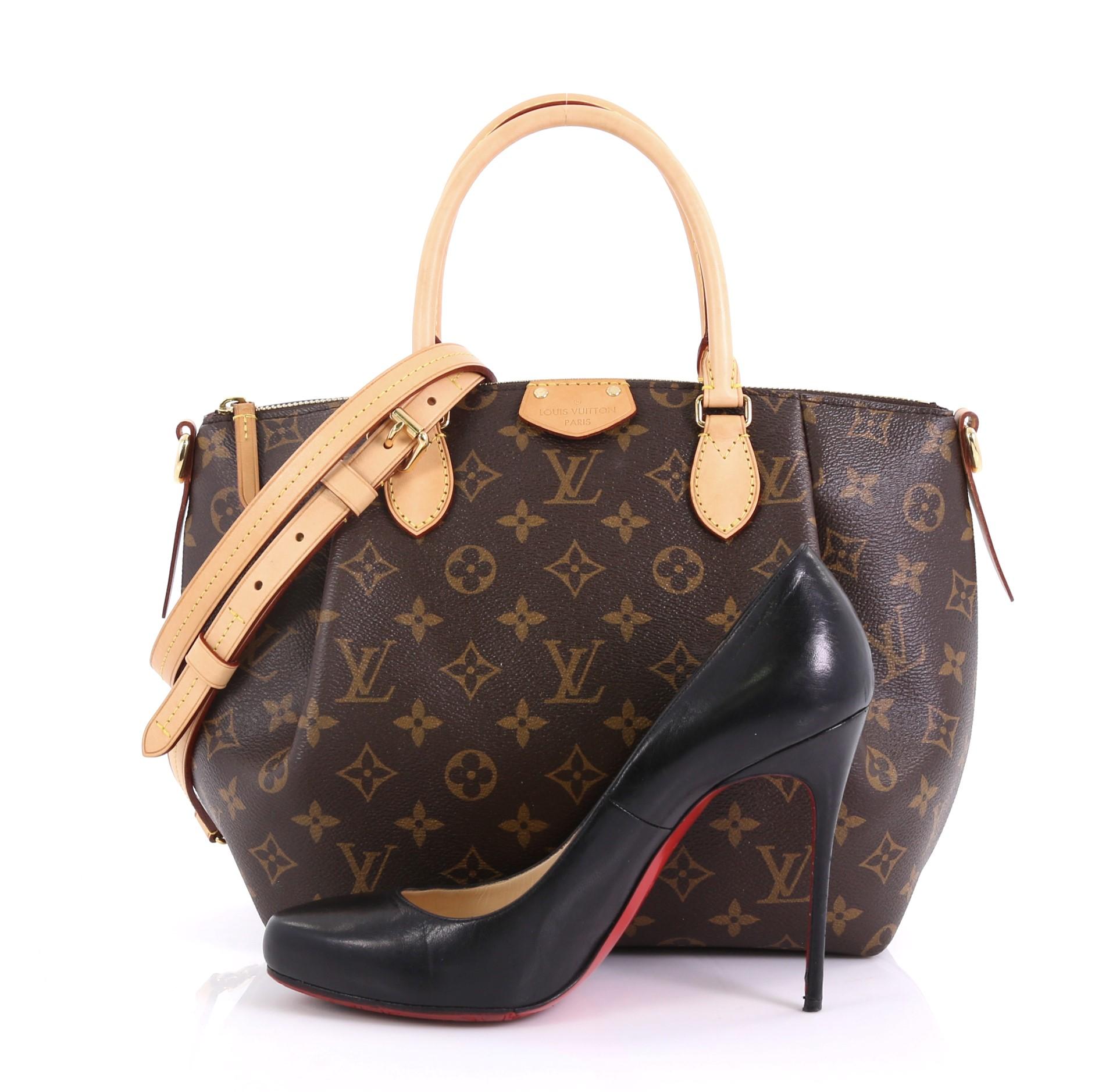 This Louis Vuitton Turenne Handbag Monogram Canvas PM, crafted in brown monogram coated canvas, features dual rolled leather handles, front pleats, and gold-tone hardware. Its zip closure opens to a purple fabric interior with slip pockets.