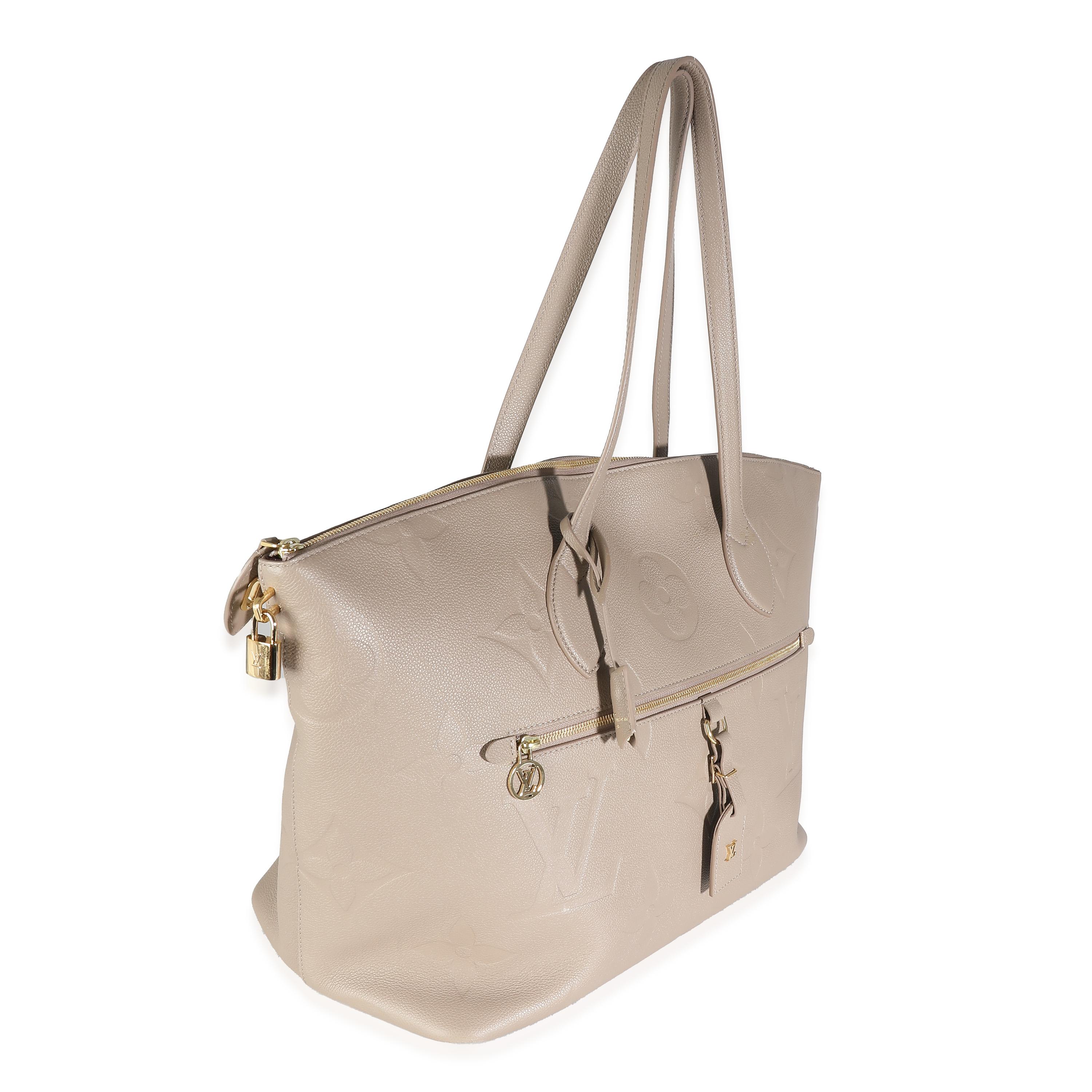 Listing Title: Louis Vuitton Turtledove Monogram Empreinte Travel Bag
SKU: 138390
MSRP: 3950.00 USD
Condition: Pre-owned 
Handbag Condition: Very Good
Condition Comments: Item is in very good condition with minor signs of wear. Moderate scuffing and