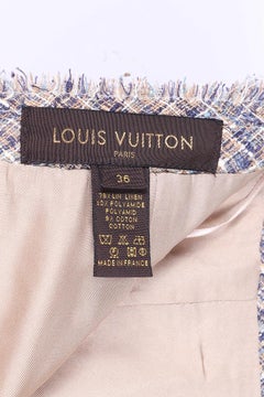 Louis Vuitton tweed suit with a skirt and top