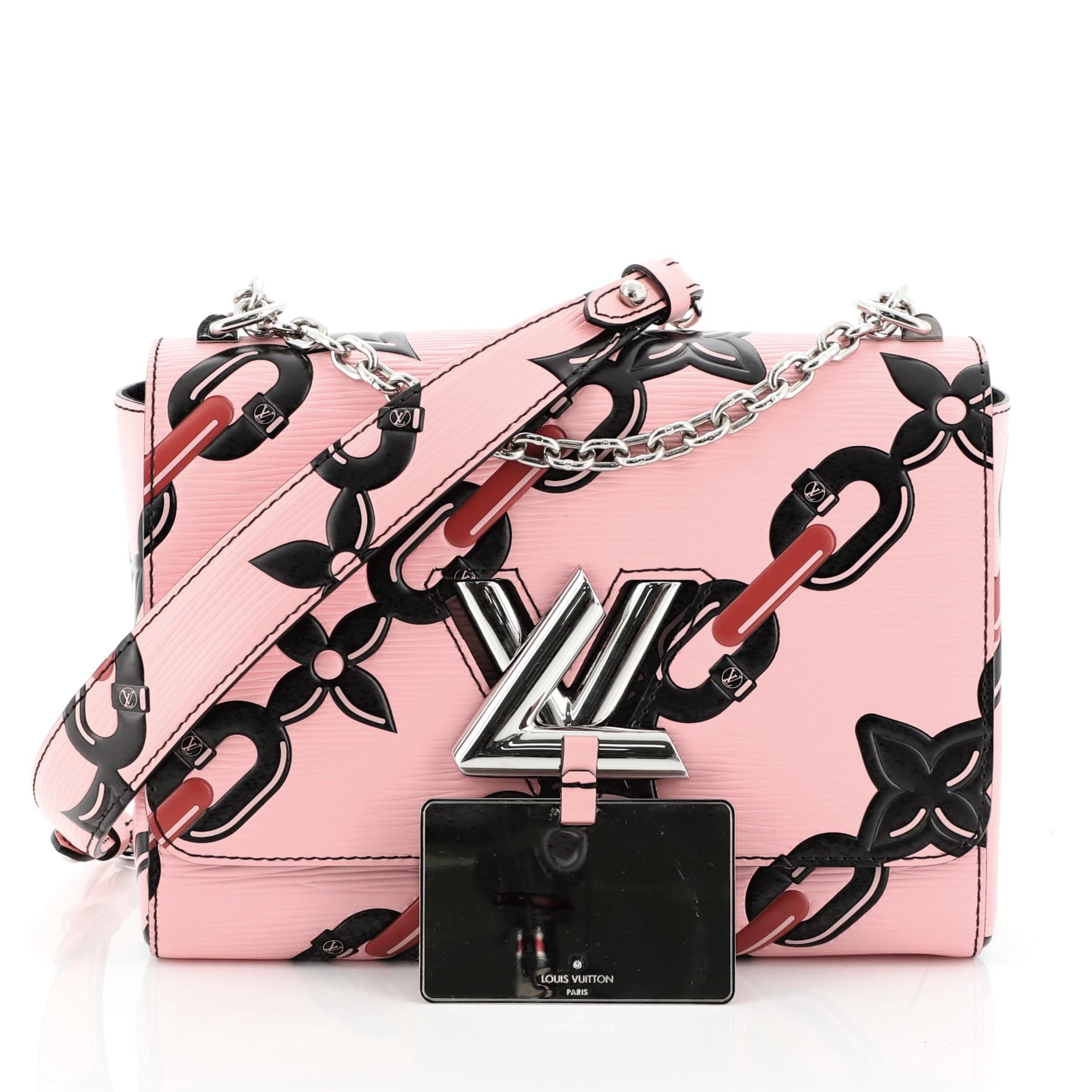 This Louis Vuitton Twist Handbag Chain Flower Print Epi Leather MM, crafted in pink printed epi leather, features a waved base silhouette, chain link strap with leather pad, and silver-tone hardware. Its LV twist lock closure opens to a black