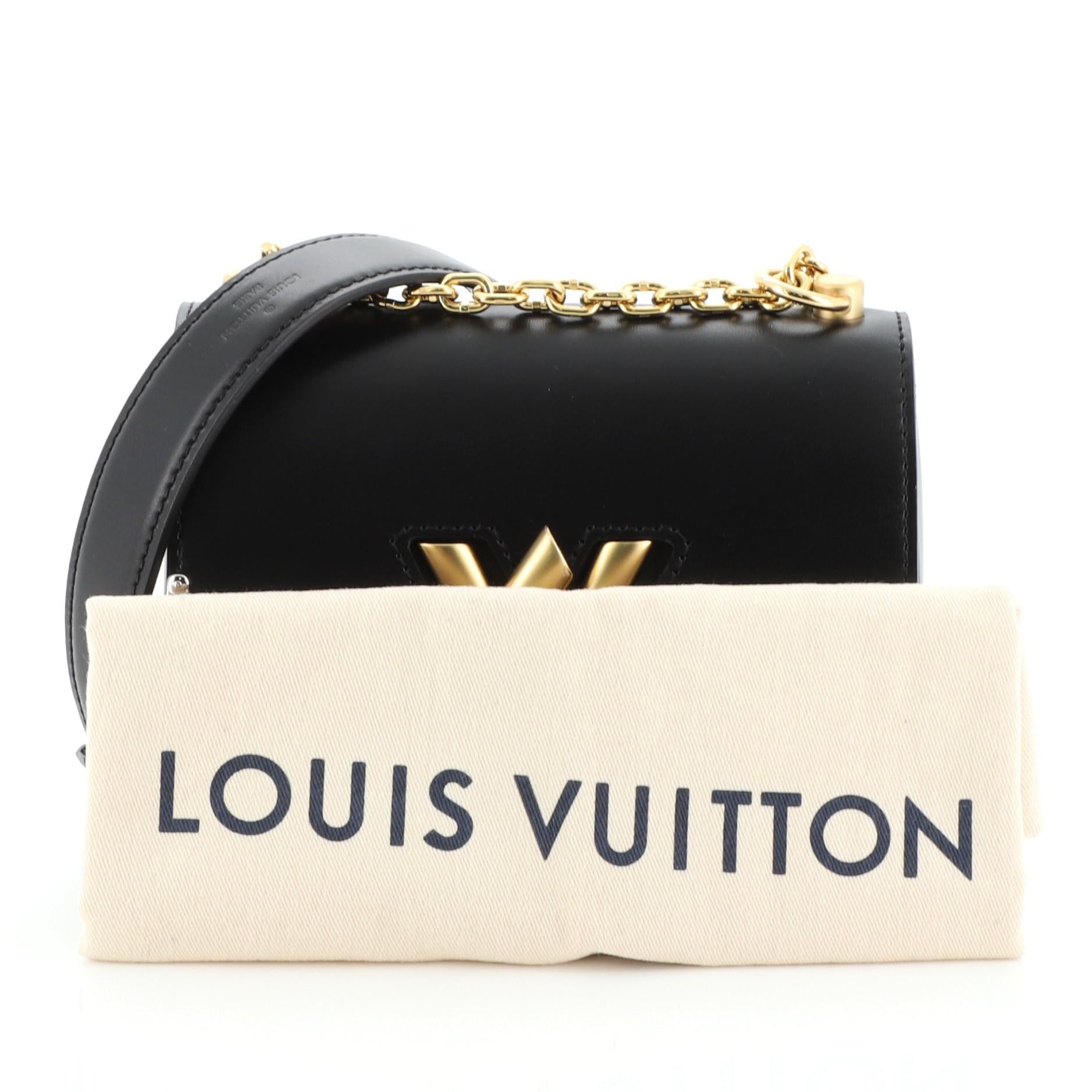 This Louis Vuitton Twist Handbag Embellished Calfskin PM, crafted from black embellished calfskin leather, features chain link strap with leather pad, frontal flap, and matte gold-tone hardware. Its LV twist lock closure opens to a black microfiber