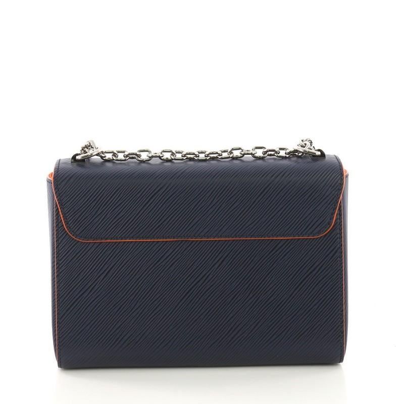 Louis Vuitton Twist Handbag Epi Leather MM, crafted from navy epi leather In Excellent Condition In NY, NY