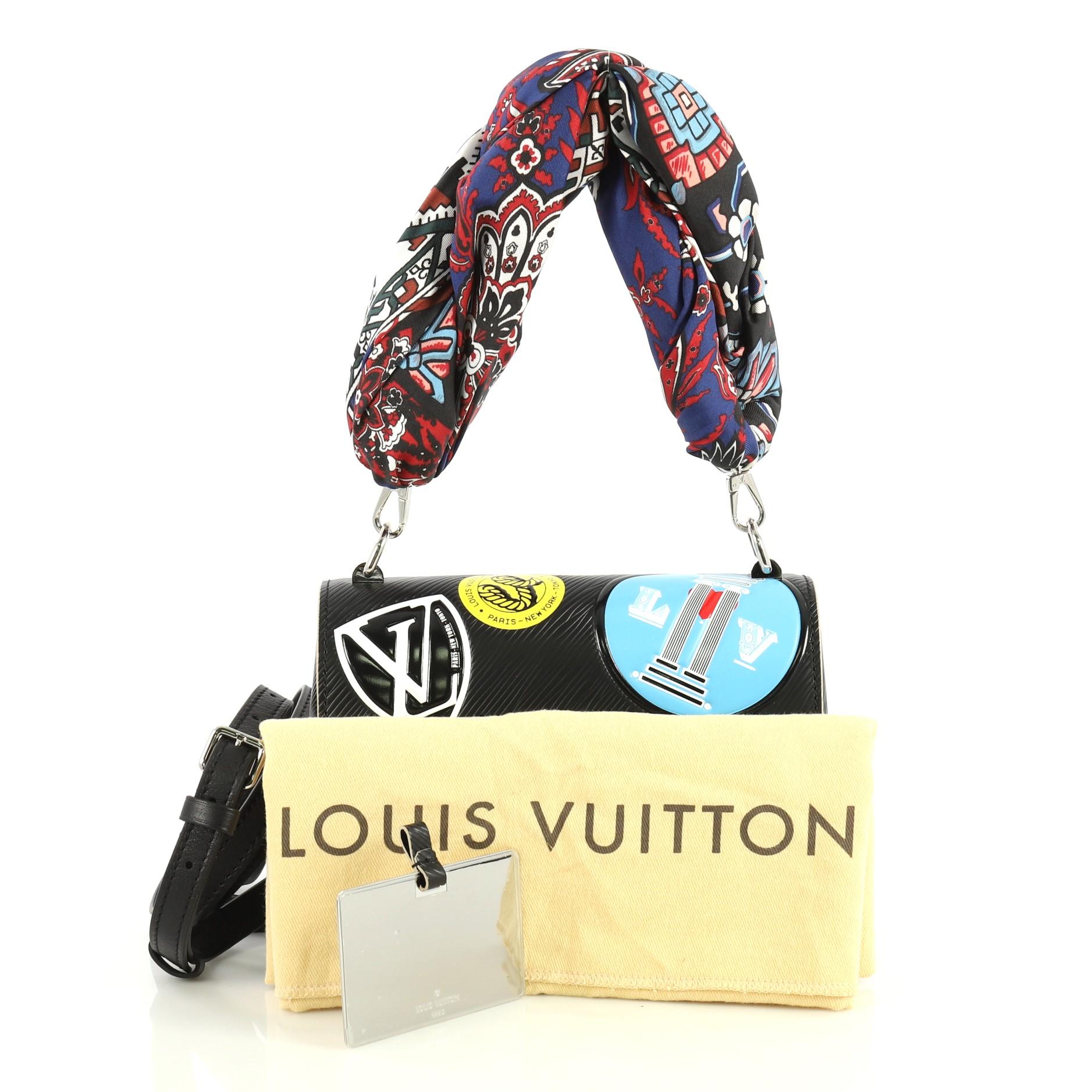 This Louis Vuitton Twist Handbag Limited Edition World Tour Epi Leather PM, crafted from black epi leather, features multicolored fabric handle, LV twist lock, world tour stickers and silver-tone hardware. Its LV twist-lock opens to a black