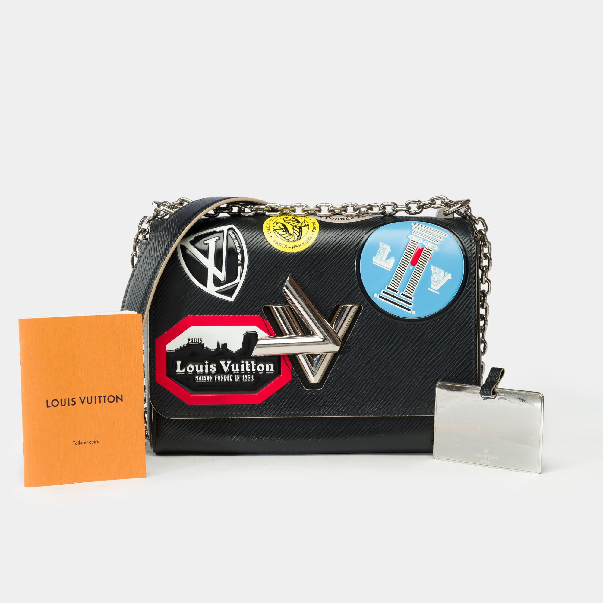 Magnificent​ ​Louis​ ​Vuitton​ ​MM​ ​Twist​ ​World​ ​Tour​ ​limited​ ​edition​ ​flap​ ​shoulder​ ​bag​ ​in​ ​black​ ​epi​ ​leather,​ ​silver-tone​ ​metal​ ​trim,​ ​silver-tone​ ​metal​ ​handle​ ​for​ ​shoulder​ ​or​ ​crossbody​ ​carry

Flap​