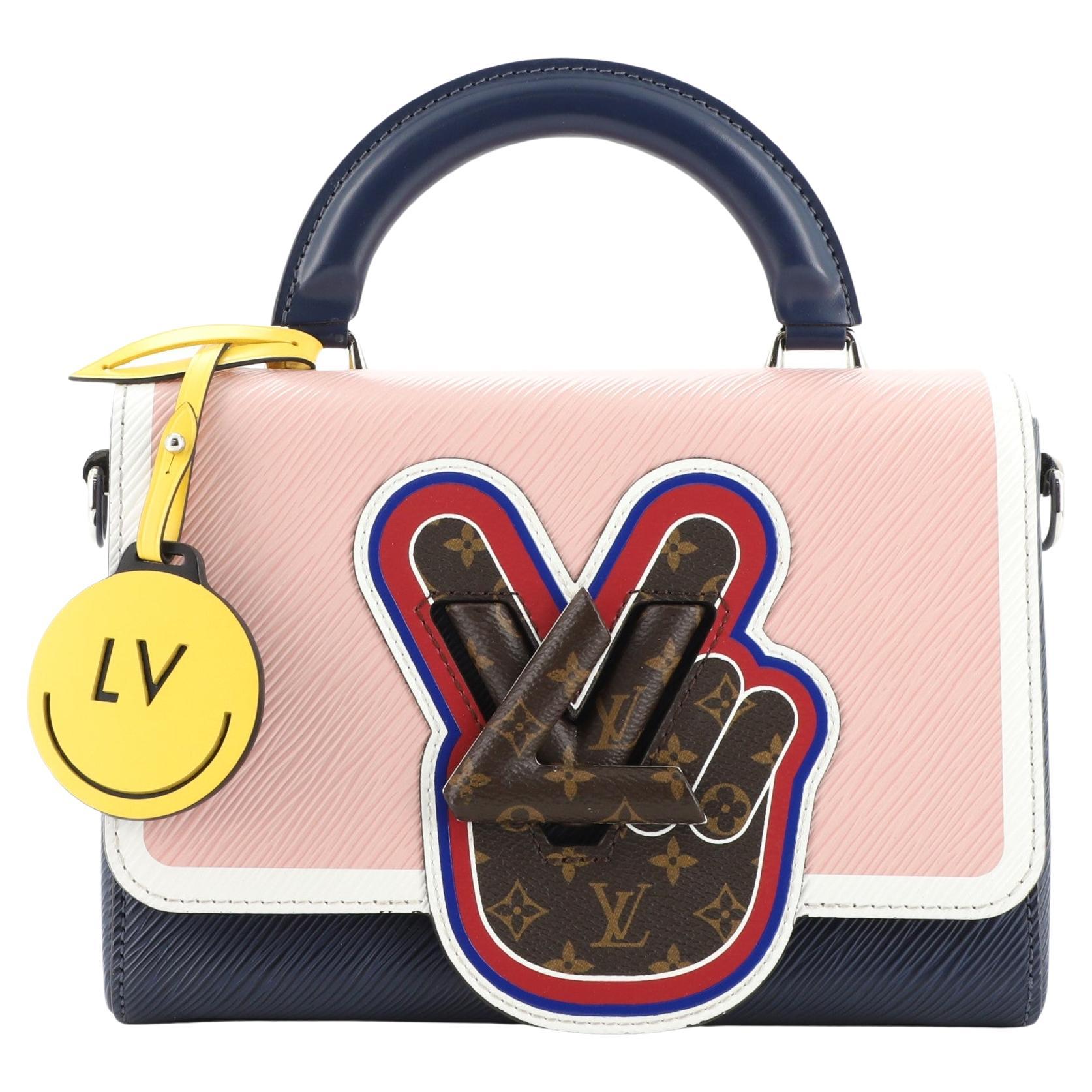 Compact twist mini Louis Vuitton in bright pink and a matching