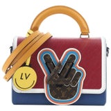 Peace, Love & Louis Vuitton: Fringe top, Flare denim & Vintage bag