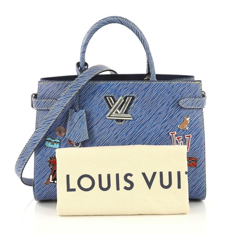 This Louis Vuitton Twist Tote Limited Edition Pins Embellished Epi Leather, crafted in blue epi leather, features two Toron handles, pins embellishment, and silver-tone hardware. Its twist lock closure opens to a blue microfiber interior with two