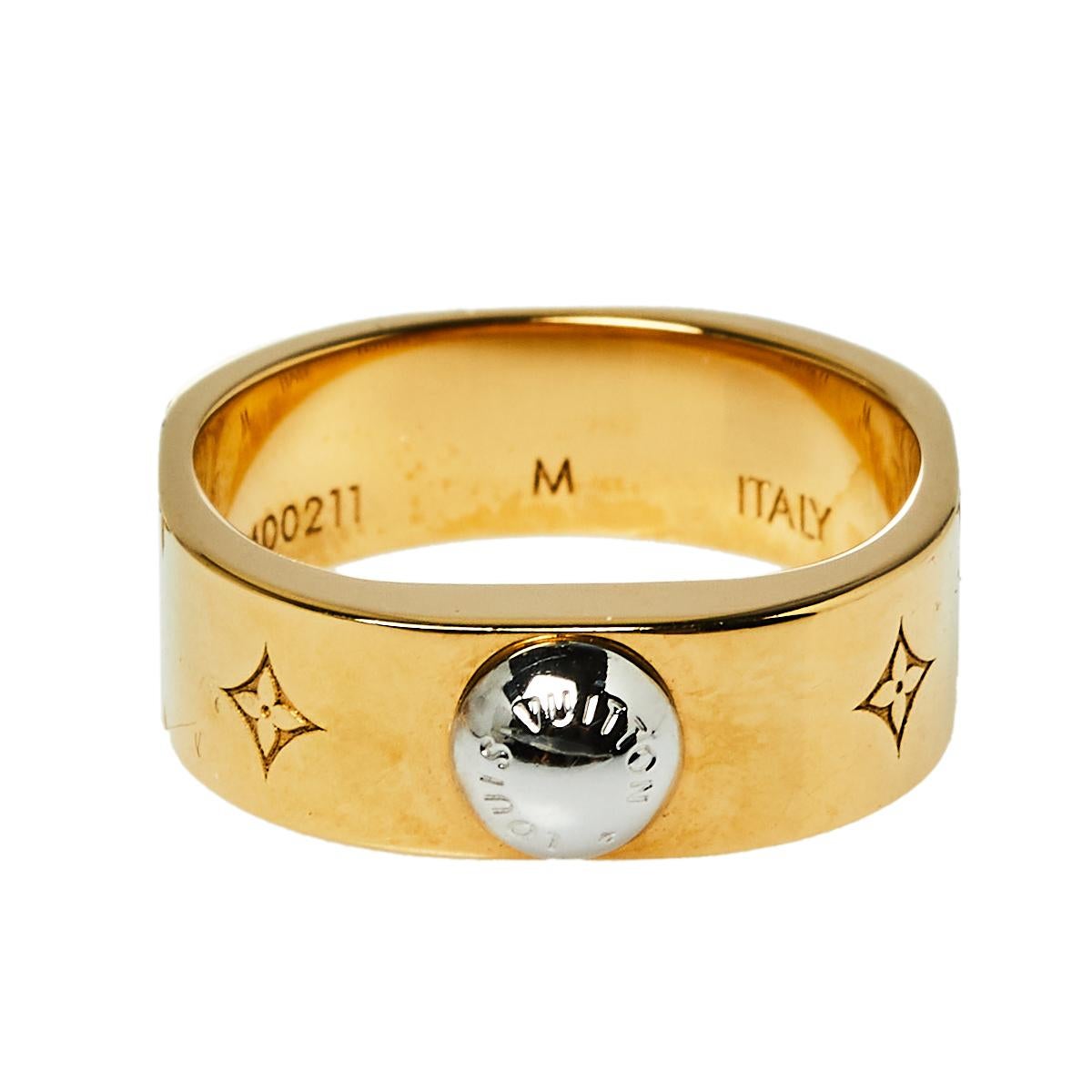 Bound to sit around your finger and exude beauty, this Louis Vuitton Nanogram ring is a great buy. It is made from two-tone metal and engraved with signature motifs. The ring has a smooth finish and a luxe appeal.

Includes: Original Dustbag,