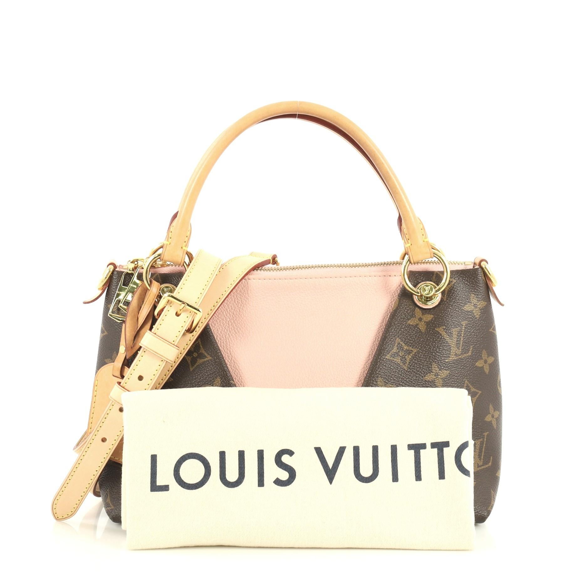 This Louis Vuitton V Tote Monogram Canvas and Leather BB, crafted from brown monogram coated canvas and pink leather, features dual rolled handles and gold-tone hardware. Its zip closure opens to a pink microfiber interior with slip pockets.