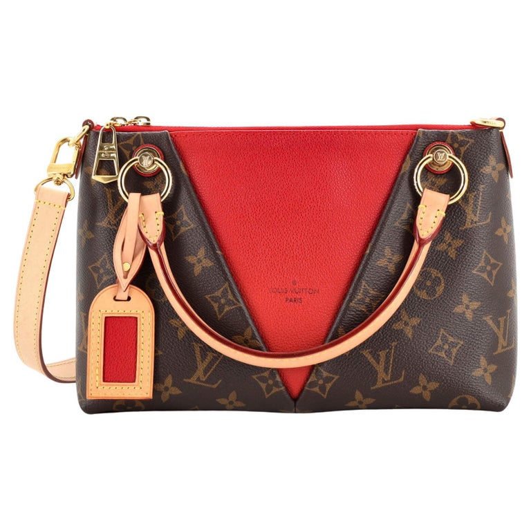 At Auction: Louis Vuitton, LOUIS VUITTON. Red URS Fisher pochette bag. Black  leather with red monograms. Short handle in red leather. Comes with dust bag.  Black interior. Zipper closure. In good condition.