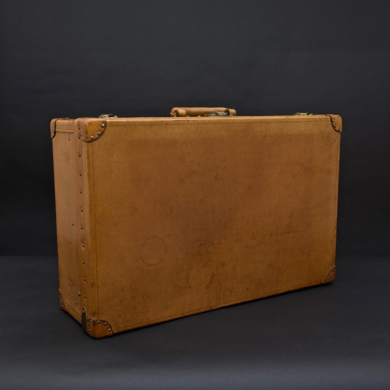 A superb 'Vache Naturelle' suitcase by Louis Vuitton. With original cotton lined interior (missing tray), circa 1935.

Louis Vuitton was founded by its namesake in 1854, with the first shop on Rue Neuve des Capucines in Paris, France. Monsieur