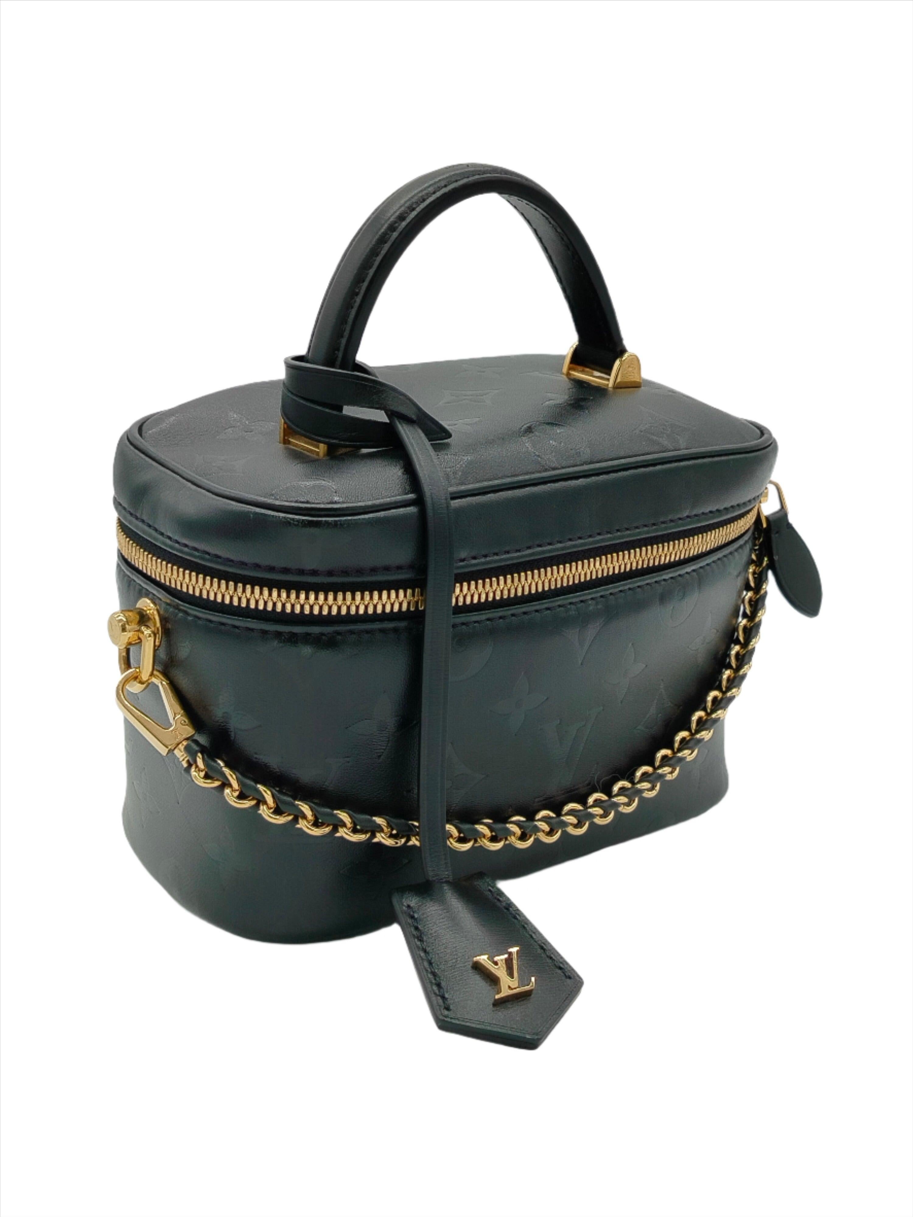 Crafted from fluffy lambskin, the Vanity handbag is lightweight, compact and soft with a detachable braided leather chain for carrying by hand, over the shoulder or across the body. Featuring a gold-colored LV padlock and leather key bell, this