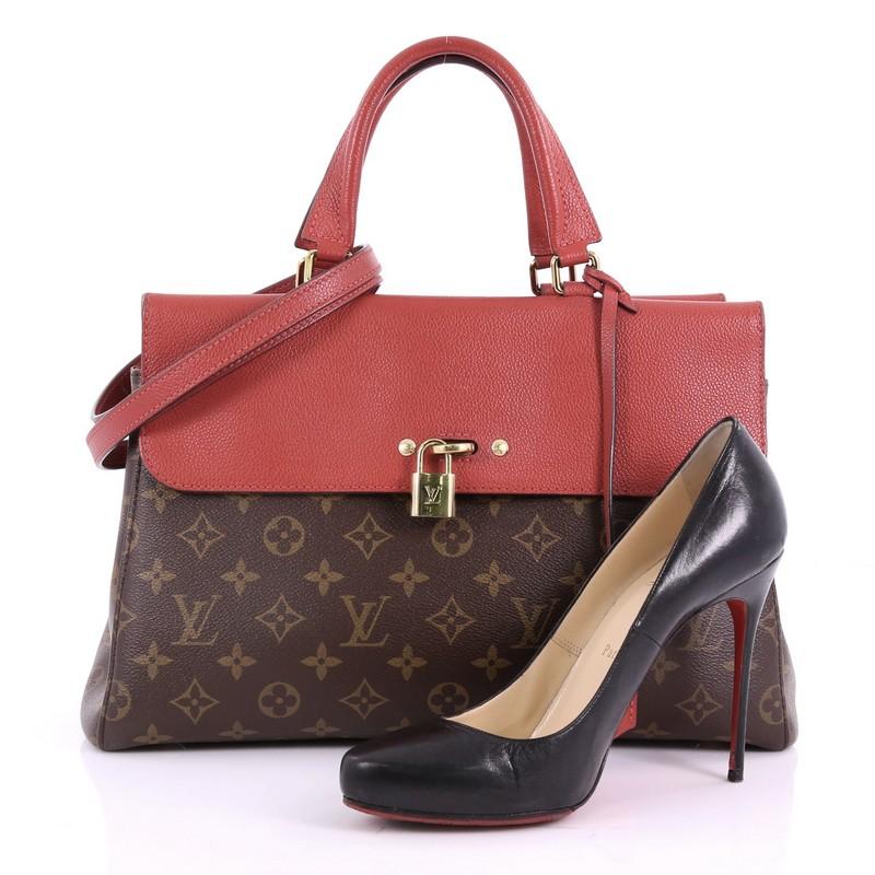 This Louis Vuitton Venus Handbag Monogram Canvas and Leather, crafted from brown monogram coated canvas and red leather, features dual padded leather handles, exterior front and back compartments, protective base studs and gold-tone hardware. Its