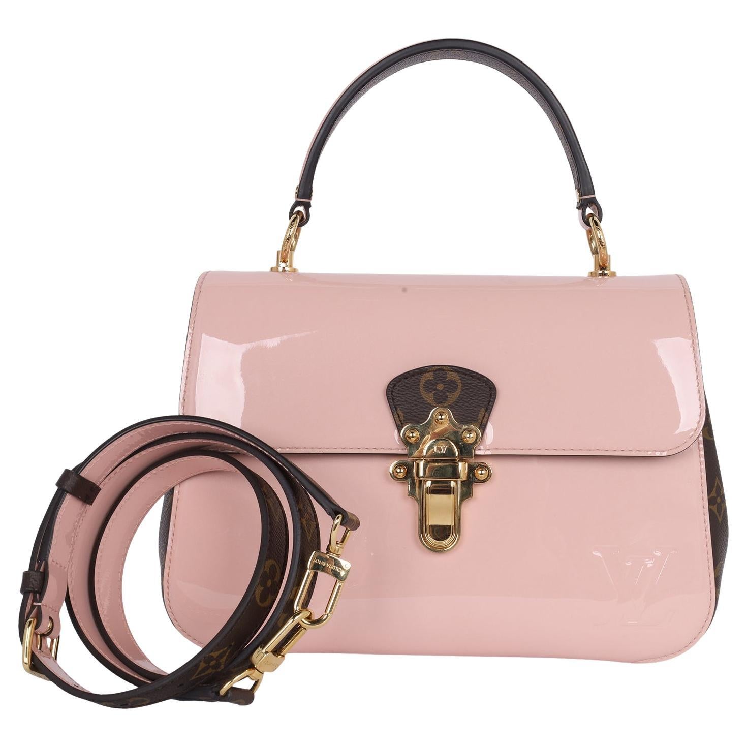 Authentic Pre Owned Louis Vuitton Vernis Leather Monogram Cherrywood Crossbody Shoulder Bag. This stylish shoulder bag features a top handle, a mirror glossy patent leather in pink with Louis Vuitton monogram coated canvas sides, polished gold