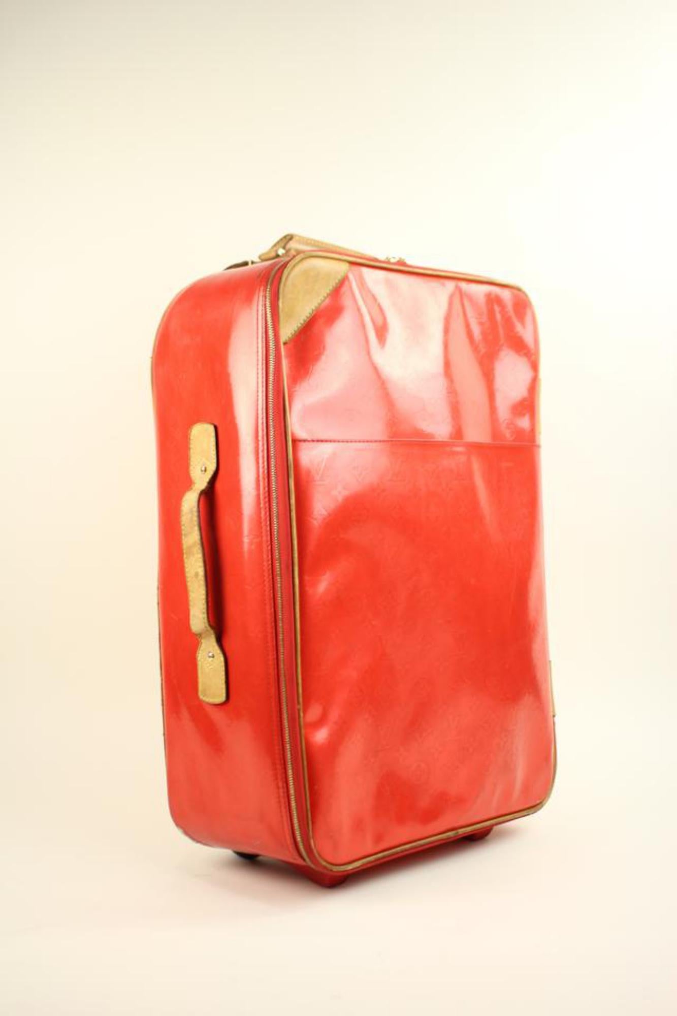 Louis Vuitton Vernis Red Rolling Suitcase 
This item will ship immediately!
Previously owned.
Made In:France
Measurements: Length: 14.5 Width: 7.5 Height: 21.5
Zipper works well.
Signs of Wear: Marks on exterior Scratches on exterior. Scuff Marks on