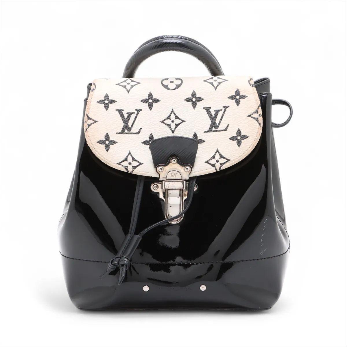 The Louis Vuitton Vernis x Monogram Hot Springs Mini Backpack in black is a stylish and versatile piece that fuses classic elegance with a modern twist. Crafted from glossy Monogram Vernis patent leather, it is accented with a striking