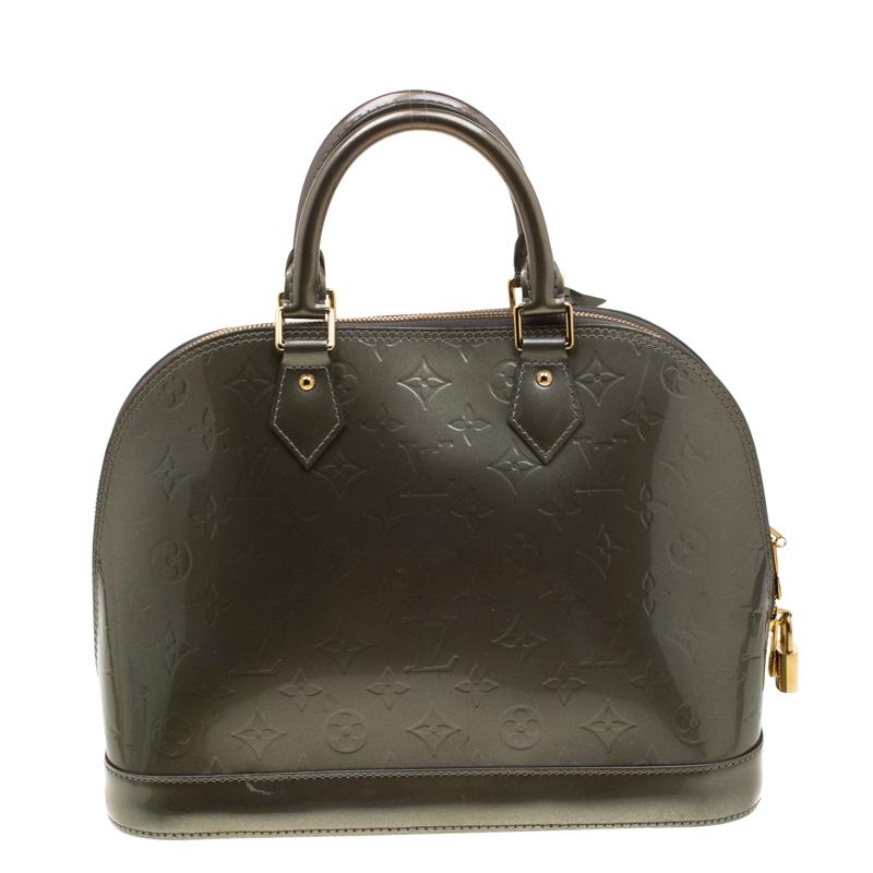 A classic from the house of Louis Vuitton, the shape of the Alma stands out. Louis Vuitton Alma was named after the Alma Bridge that connects Paris's fashionable neighborhood. The bag is made from the signature Monogram Vernis that was introduced in