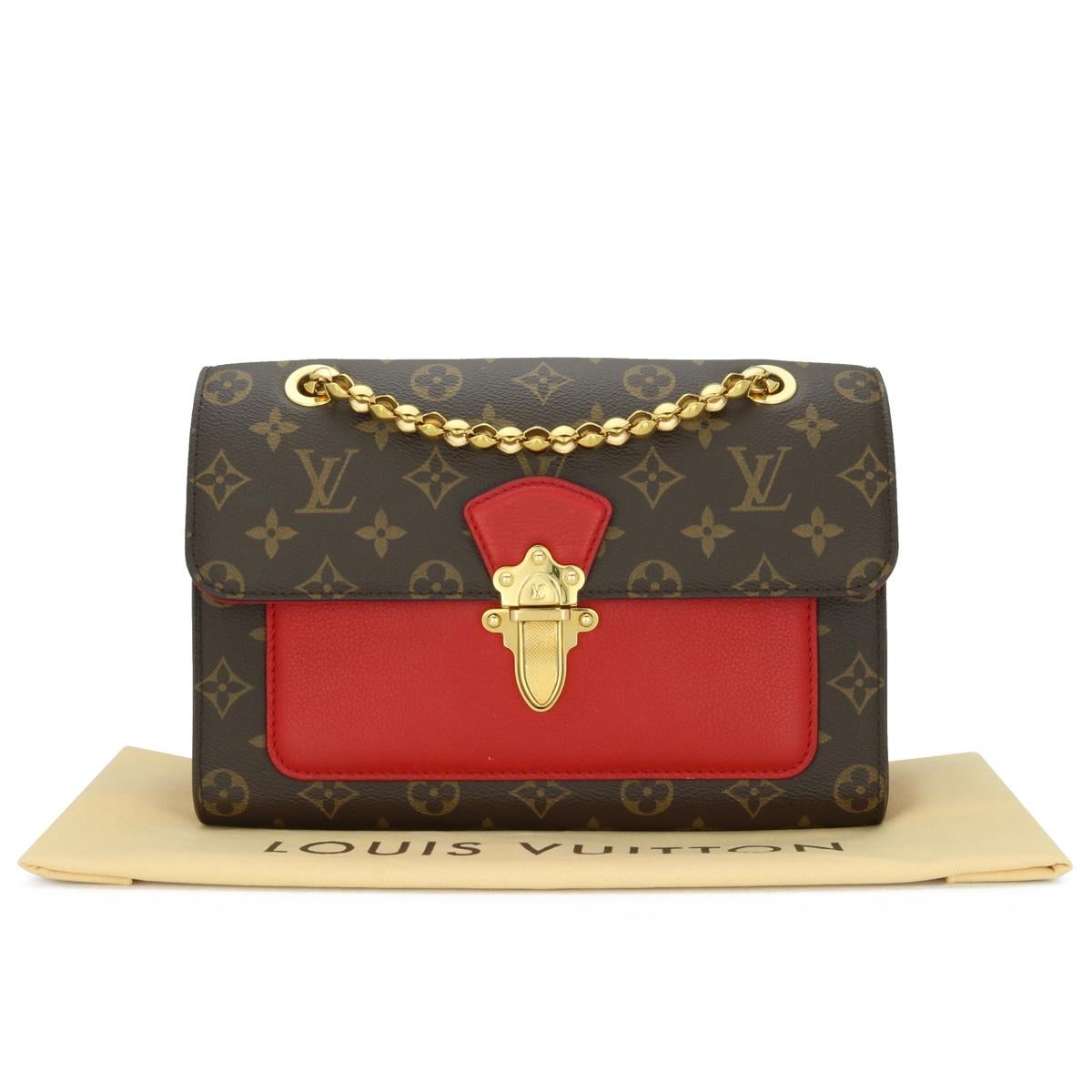 Louis Vuitton Victoire Monogram Bag with Cherry Red Interior with Gold-Tone Hardware 2016.

This bag is in good condition.

- Exterior Condition: Good condition. The outside of the bag shows general signs of wear -inking edges wear to four base