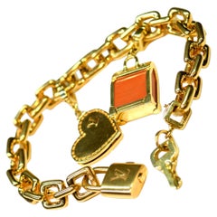 Louis Vuitton Bracelet à breloques vintage en or 18 carats avec étui d'origine