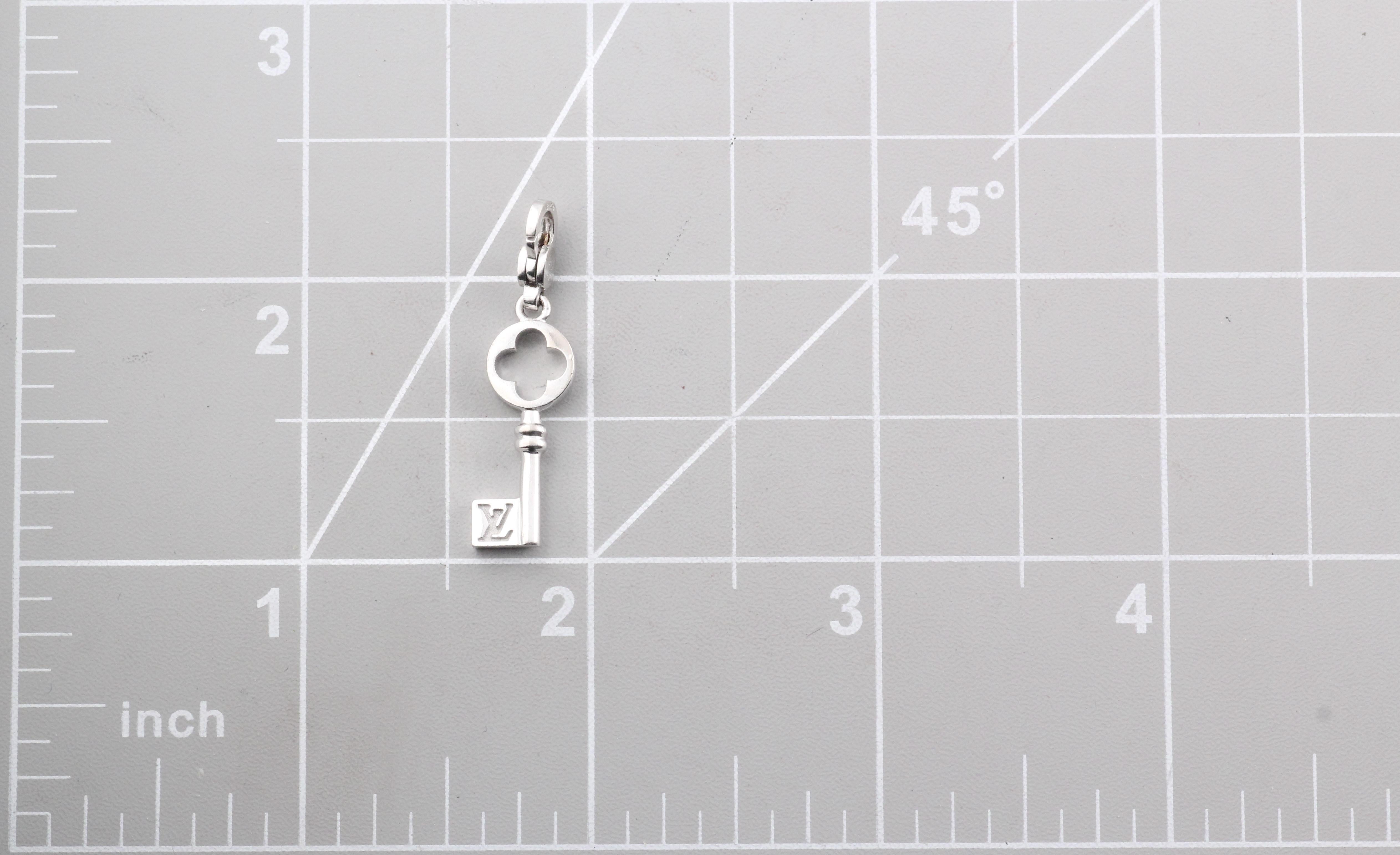 Introducing the Louis Vuitton White Gold Key Pendant, a refined piece that embodies elegance and craftsmanship. This exquisite charm necklace is a testament to Louis Vuitton's dedication to luxury and detail.

The pendant, crafted in lustrous white