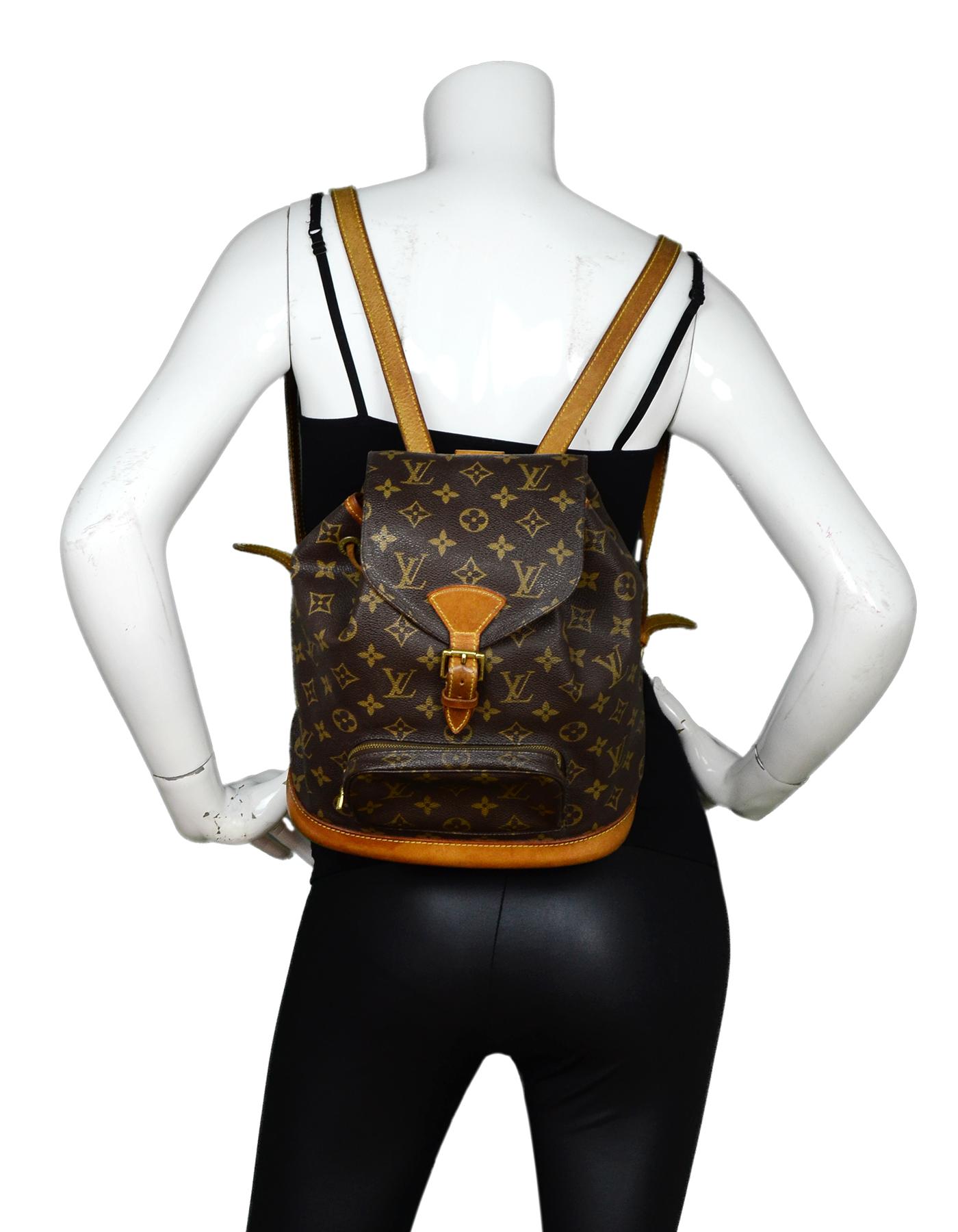 Louis Vuitton Vintage 90s LV Monogram Canvas Montsouris MM Backpack Bag

Made In: USA
Year of Production: 1998
Color: Brown/tan
Hardware: Goldtone
Materials: Coated canvas, leather
Lining: Brown canvas textile
Closure/Opening: Flap top with buckle