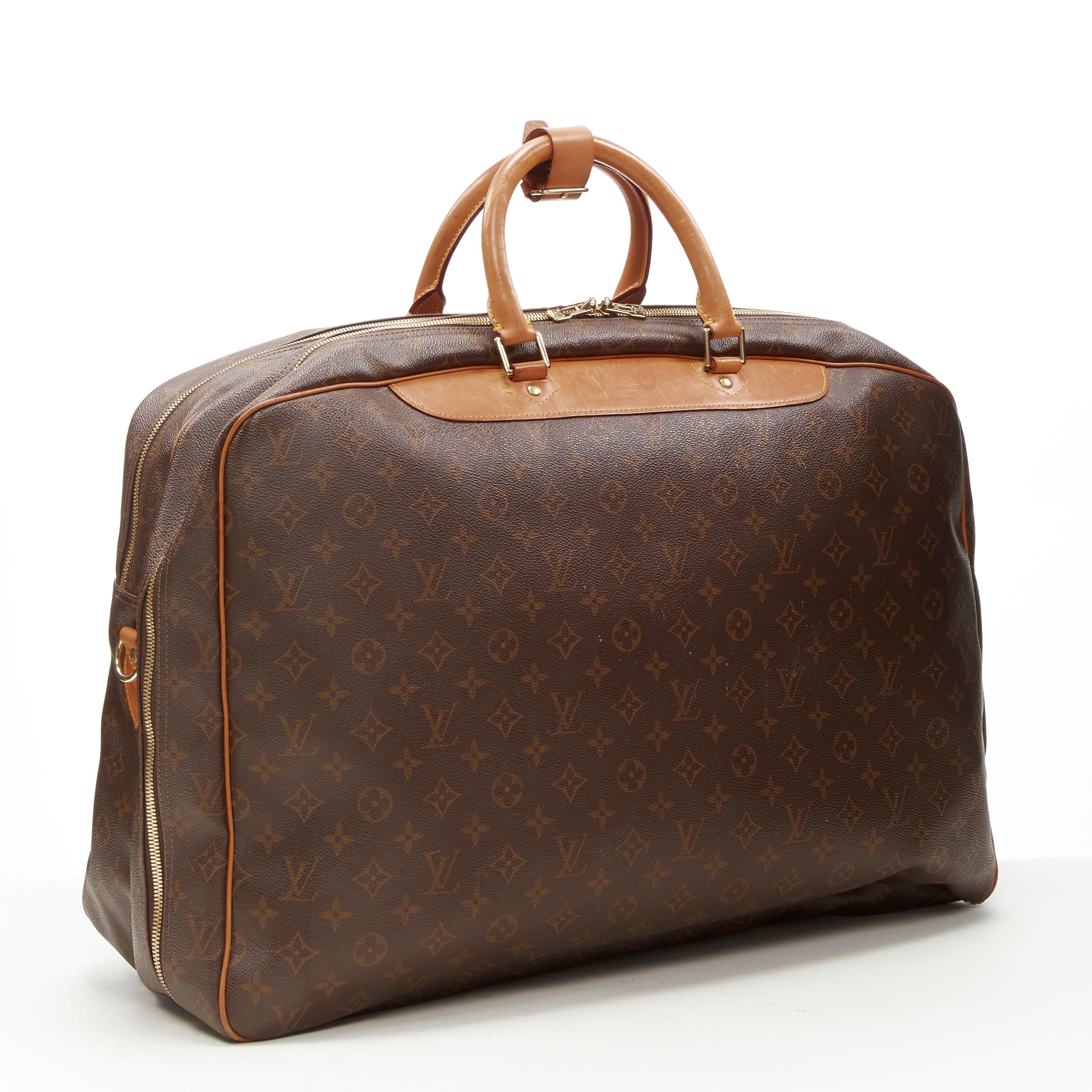 LOUIS VUITTON VIntage Alize brown monogram leather 2 compartment bag garment bag 
Reference: AEMA/A00079 
Brand: Louis Vuitton 
Model: Alize 
Material: Canvas 
Color: Brown 
Pattern: Solid 
Closure: Zip 
Extra Detail: Alize 2 compartment weekender