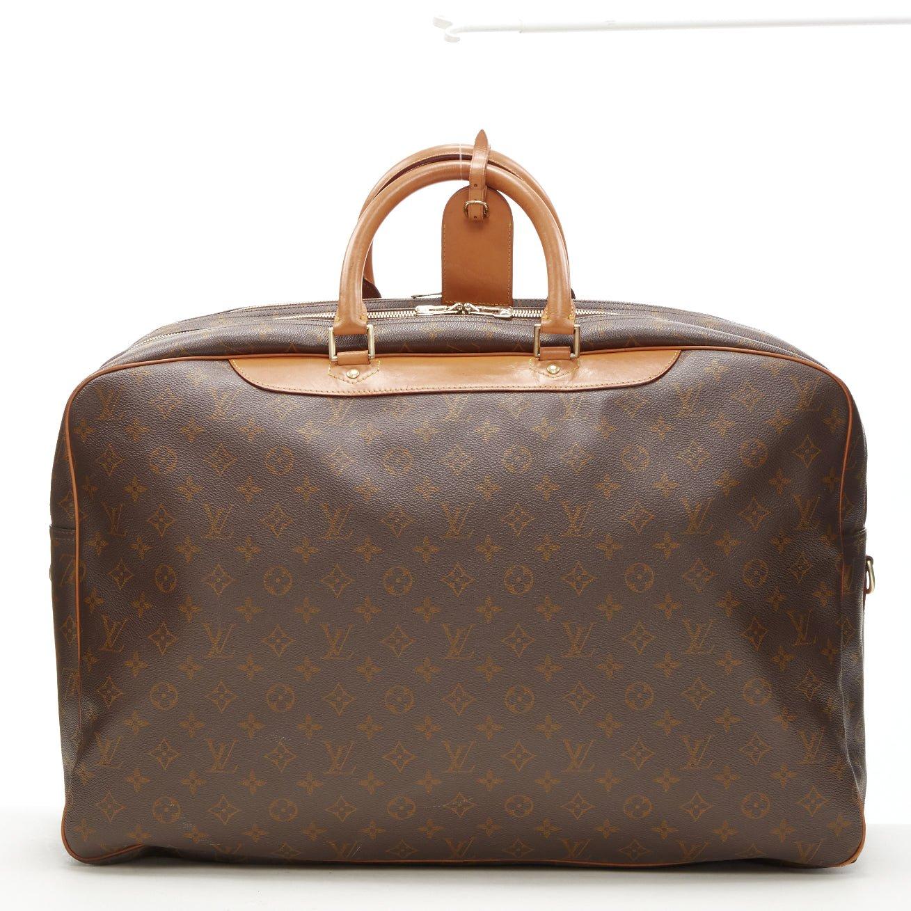 LOUIS VUITTON VIntage Alize brown monogram leather trim 2 compartment bag
Reference: AEMA/A00078
Brand: Louis Vuitton
Model: Alize
Material: Canvas, Leather
Color: Brown
Pattern: Solid
Closure: Zip
Lining:  Canvas
Extra Details: Alize 2 compartent