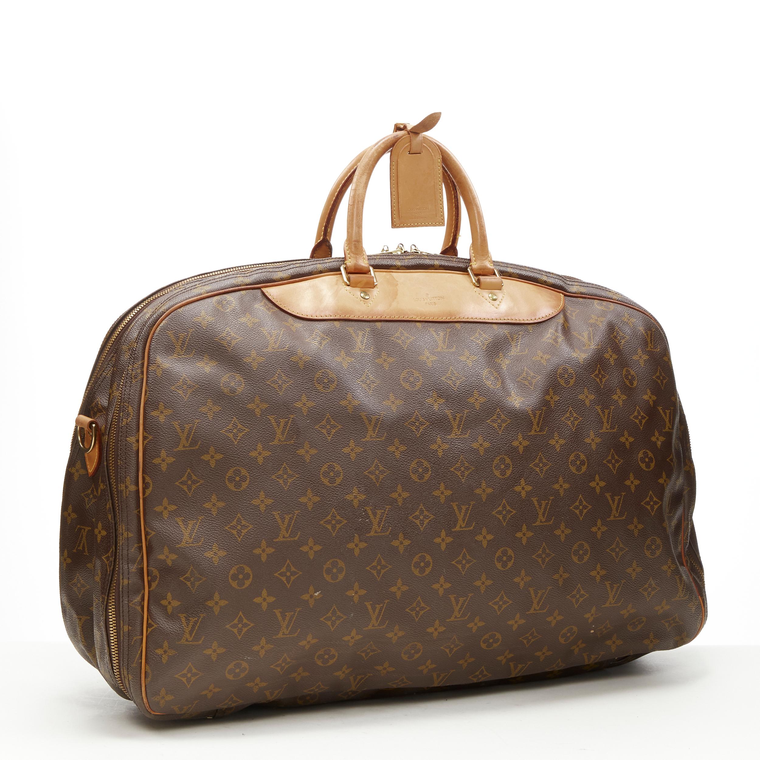 LOUIS VUITTON VIntage Alize brown monogram leather trim 2 compartment bag 
Reference: AEMA/A00077 
Brand: Louis Vuitton 
Model: Alize 
Material: Canvas 
Color: Brown 
Pattern: Solid 
Closure: Zip 
Extra Detail: Alize 2 compartent weekender carryall