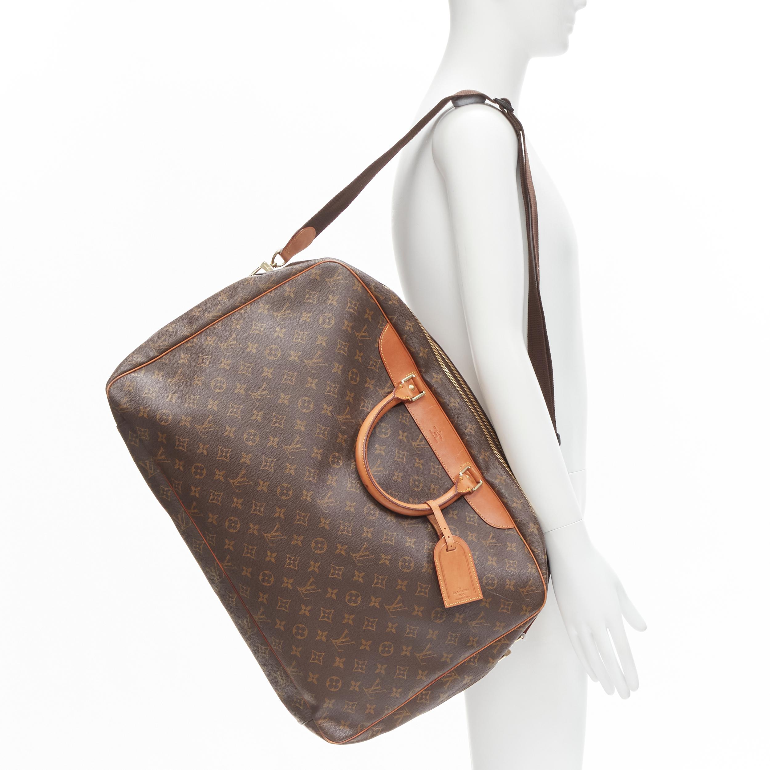 LOUIS VUITTON VIntage Alize brown monogram leather trim 2 compartment bag 
Reference: AEMA/A00078 
Brand: Louis Vuitton 
Model: Alize 
Material: Canvas 
Color: Brown 
Pattern: Solid 
Closure: Zip 
Extra Detail: Alize 2 compartent weekender carryall