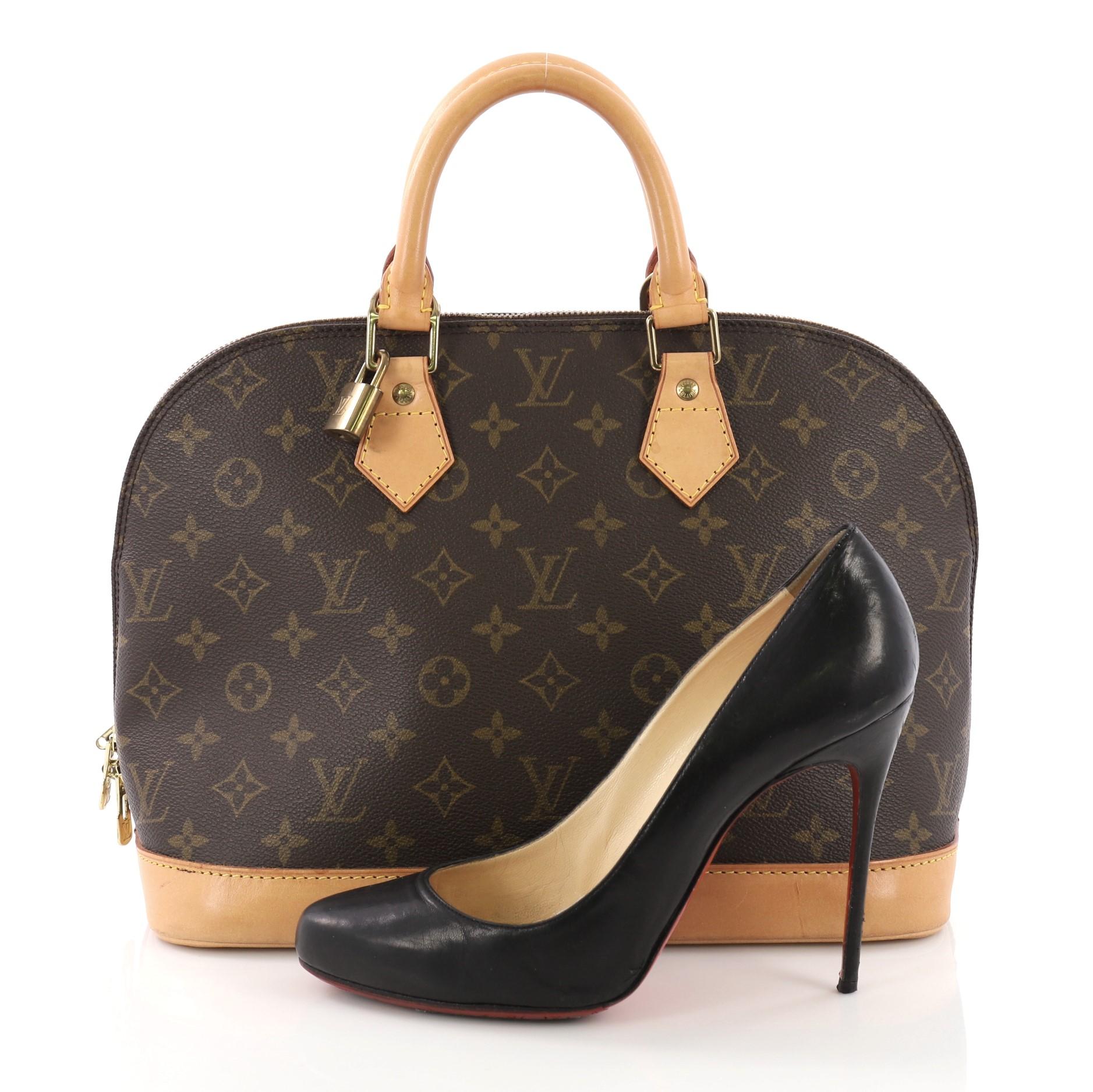 This Louis Vuitton Vintage Alma Handbag Monogram Canvas PM, crafted from brown monogram coated canvas, features dual rolled handles, leather trims, and gold-tone hardware. Its two-way zip closure opens to a brown fabric interior with slip pockets.