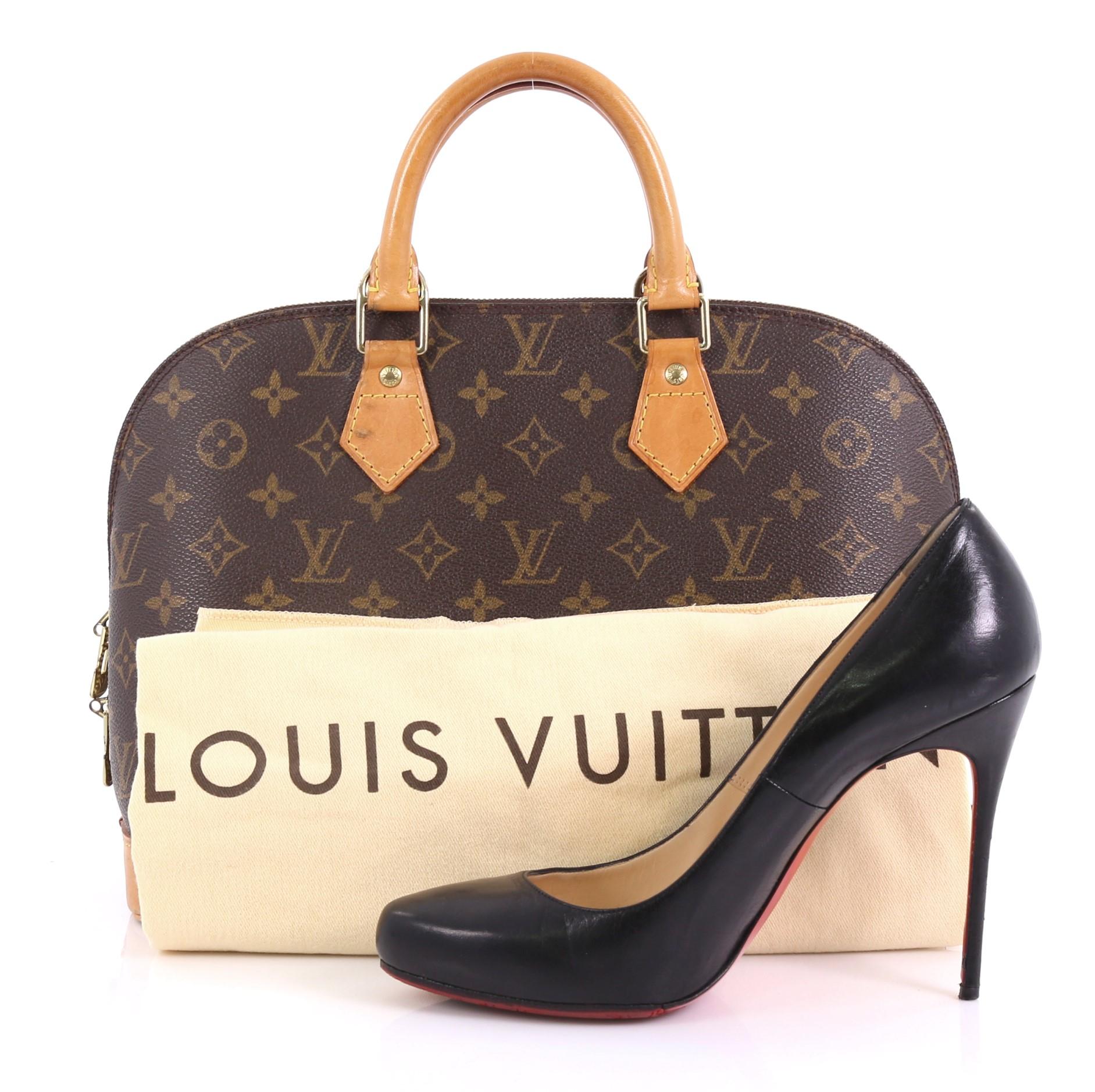 This Louis Vuitton Vintage Alma Handbag Monogram Canvas PM, crafted from brown monogram coated canvas, features dual rolled handles, leather trim, and gold-tone hardware. Its two-way zip closure opens to a brown fabric interior with slip pockets.