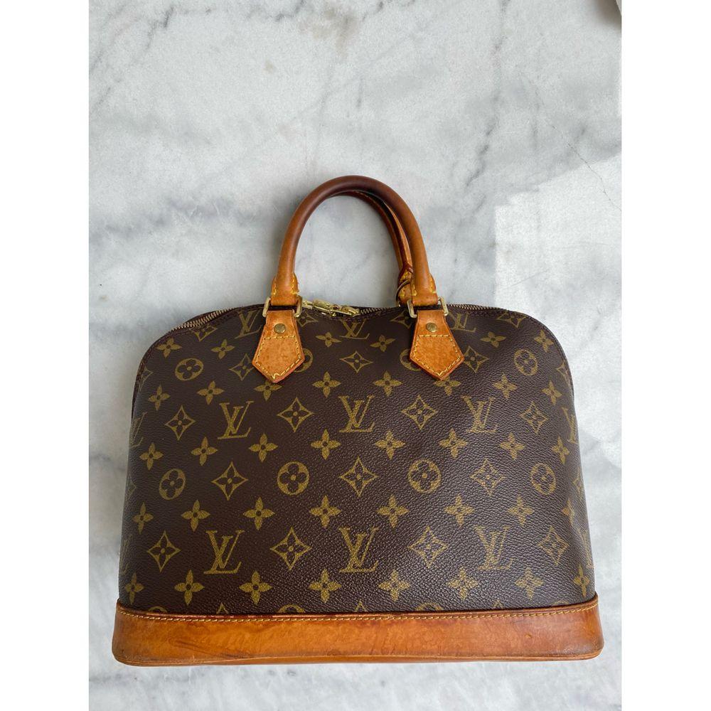 - Designer: LOUIS VUITTON
- Model: Alma
- Condition: Good condition. Exterior stains, Some stains on the leather, Sign of wear on base corners
- Accessories: None
- Measurements: Width: 30m , Height: 24cm , Depth: 16cm 
- Exterior Material: Canvas
-