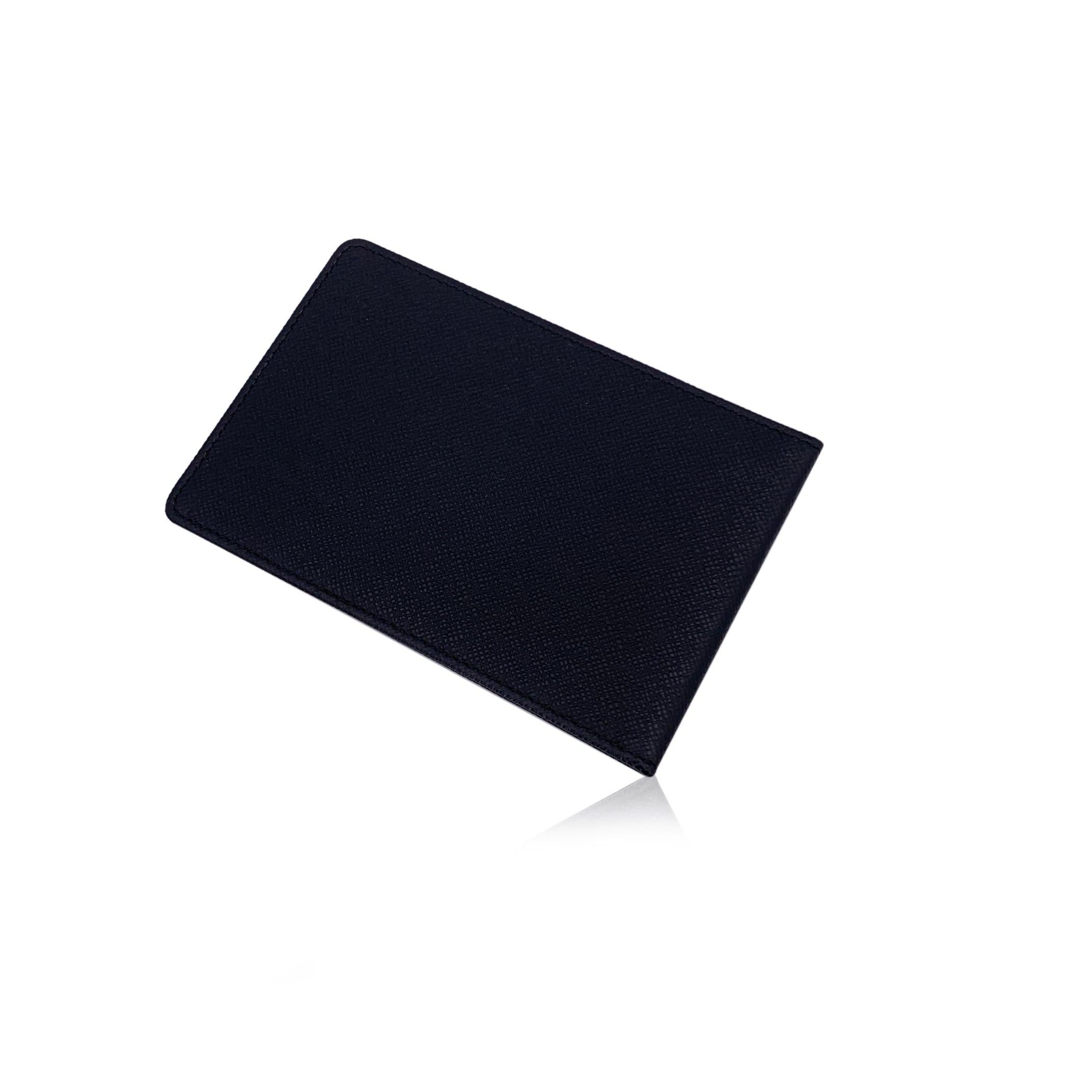Step into the world of sophisticated practicality with this Louis Vuitton Black Taiga Leather Bifold ID Document Holder, a true testament to the brand's iconic craftsmanship. Made from the brand's signature Taiga leather in a sleek black shade, this