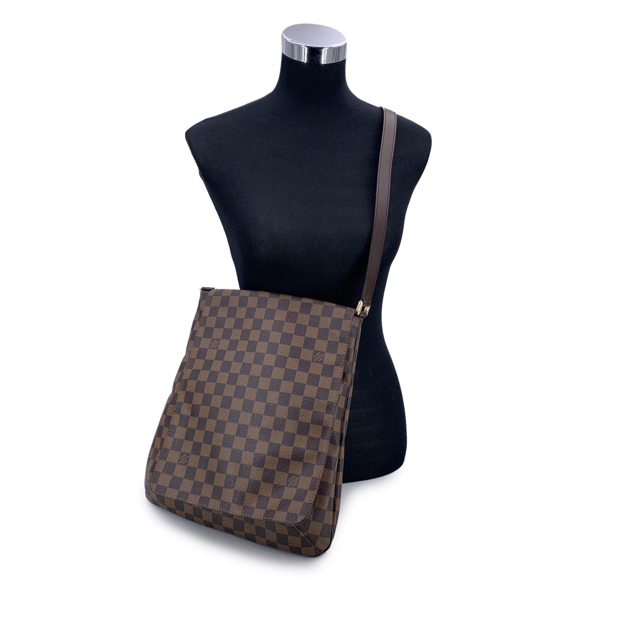 Introducing the Louis Vuitton Musette Salsa Shoulder Bag, a perfect fusion of timeless design and effortless elegance. Crafted in the brand's damier ebene canvas, this bag exudes the luxury and craftsmanship that Louis Vuitton is renowned for. The