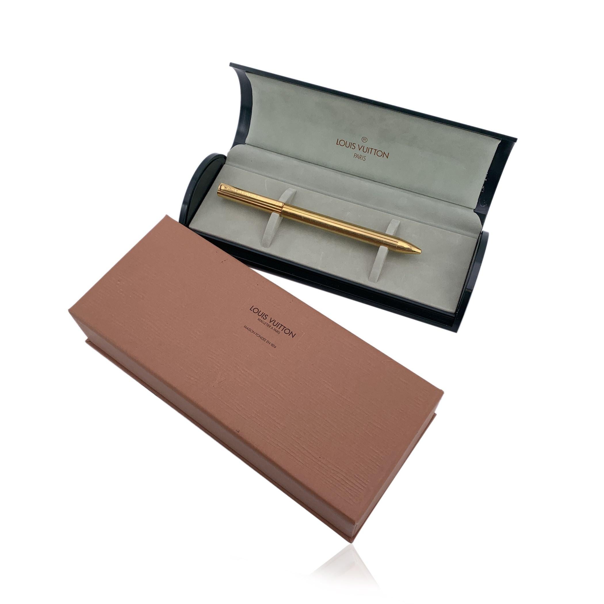 Add a touch of sophistication to your writing with this vintage Louis Vuitton Gold Metal Ballpoint Pen. A true statement of style and functionality, this pen is crafted from gold-tone metal, offering an elegant gleam that commands attention. The