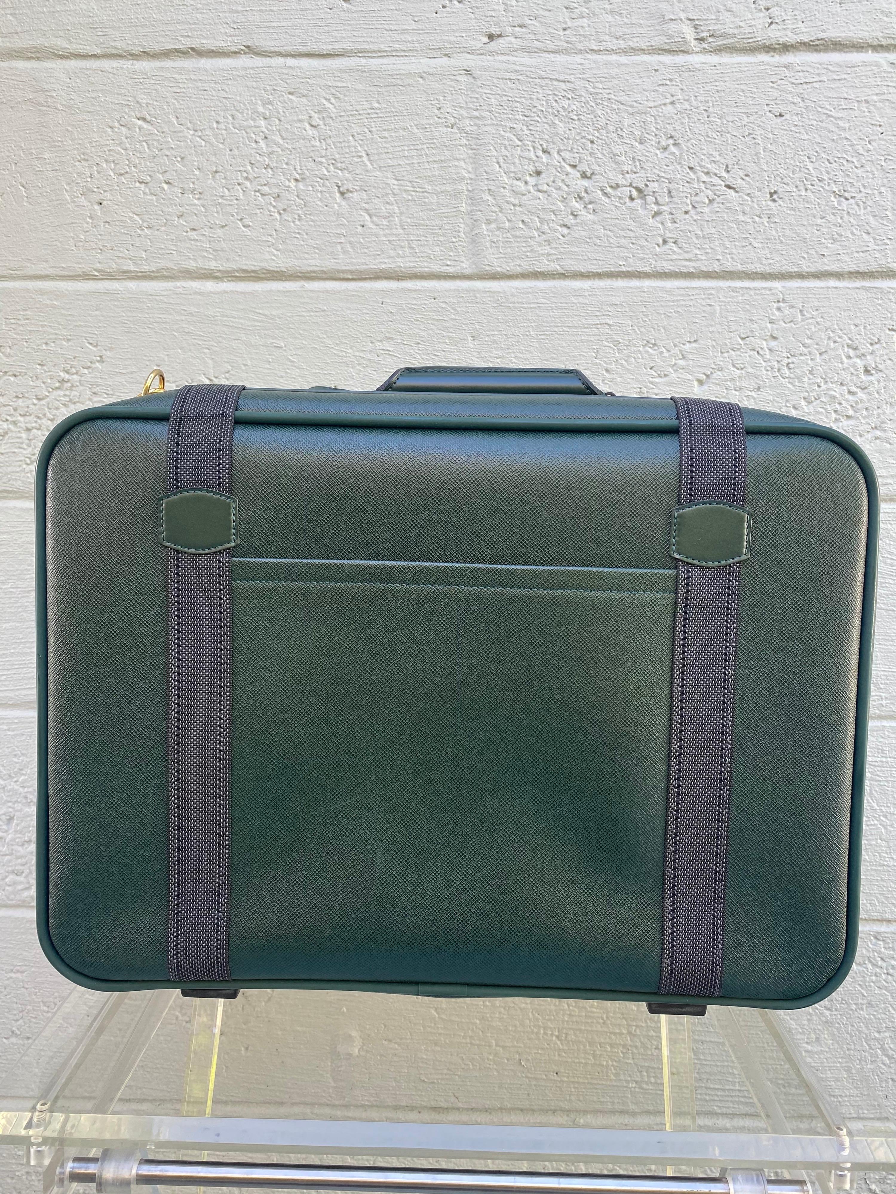 green leather suitcase