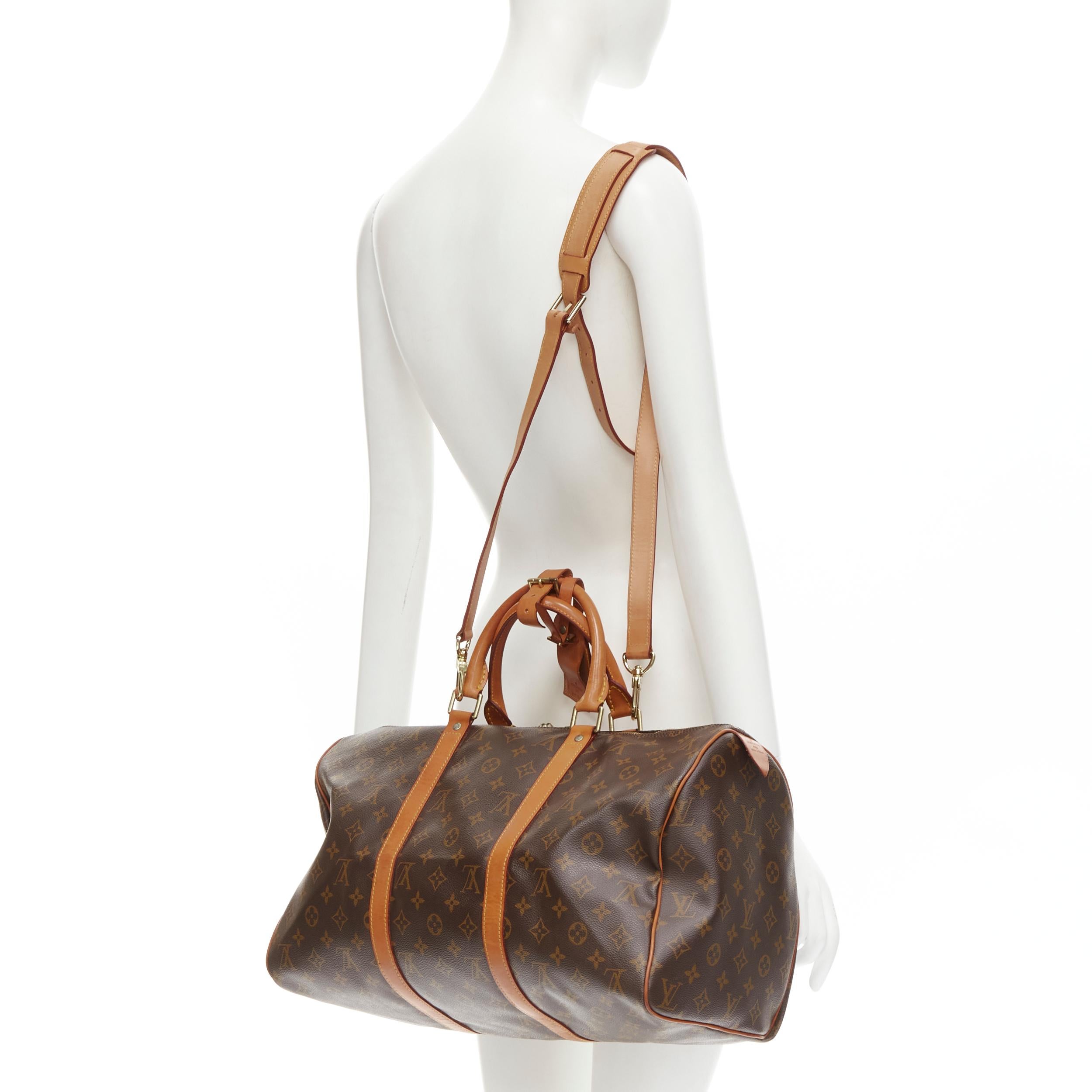 LOUIS VUITTON Vintage Keepall 45 brown monogram canvas leather trim carryall bag 
Reference: AEMA/A00076 
Brand: Louis Vuitton 
Model: Speedy 45 
Material: Canvas 
Color: Brown 
Pattern: Solids 
Closure: Zip 
Extra Detail: Speedy 45cm travel bag.