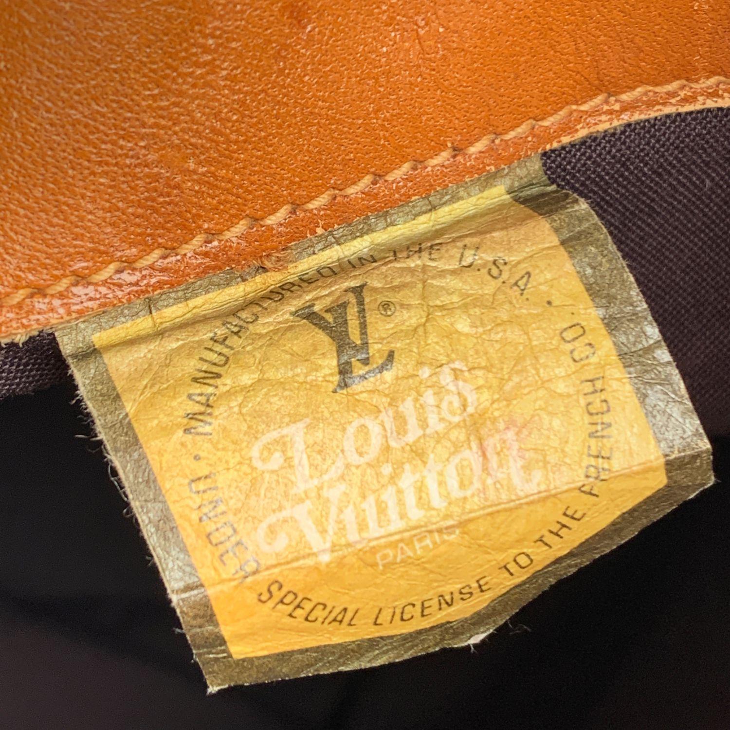 Vintage LOUIS VUITTON Monogram Bucket Bag, crafted in monogram canvas with caramel colored cowhide leather trim and handles The interior of the bag is a brown fabric with a zip pocket and a d-ring. Louis Vuitton French Company tag inside. The French
