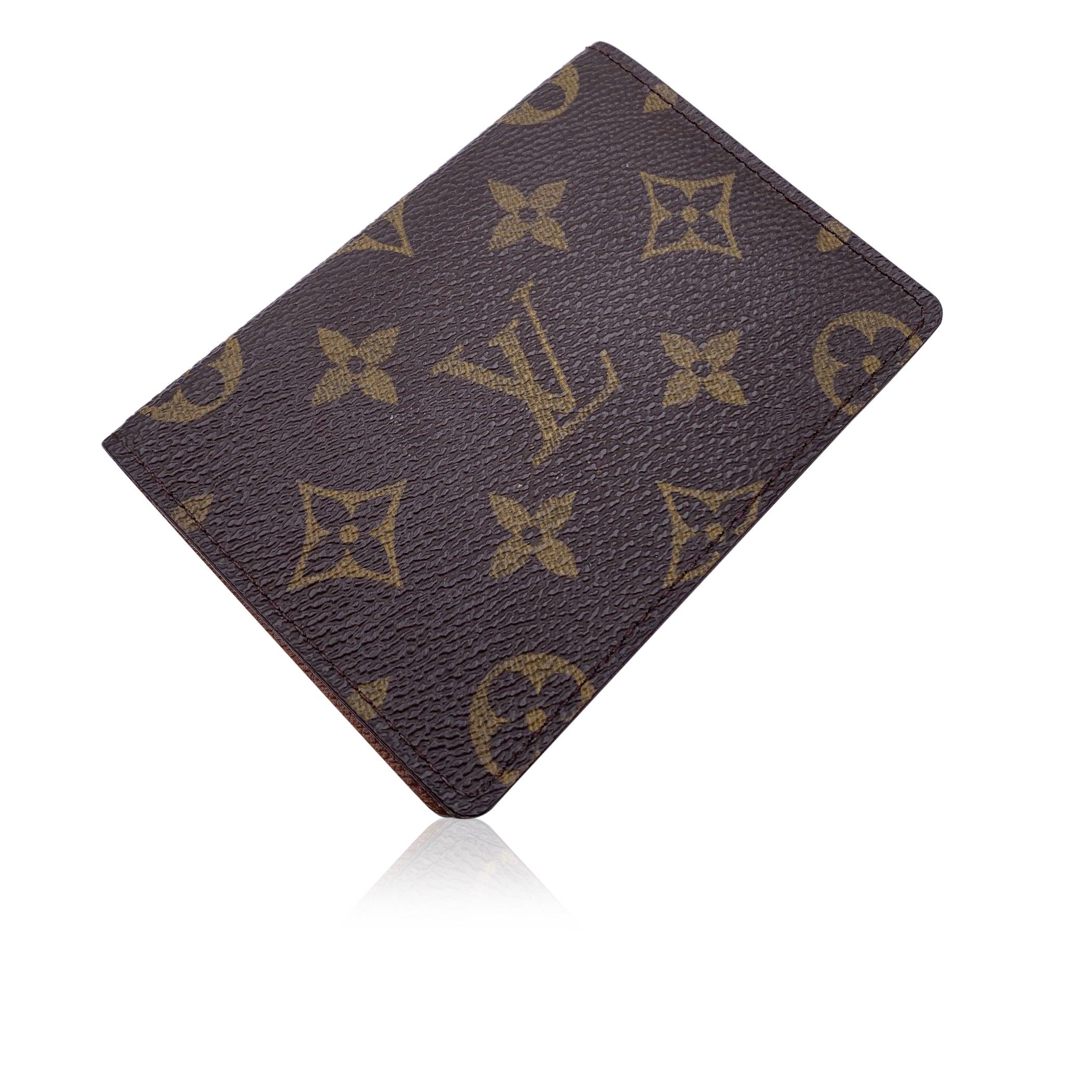Stylish card holder/wallet by LOUIS VUITTON. Crafted in signature Louis Vuitton monogram canvas. Bifold design. Brown cross grain leather interior. 2 pockets with plastic window. 'LOUIS VUITTON Paris - Made in France' embossed inside. Authenticity