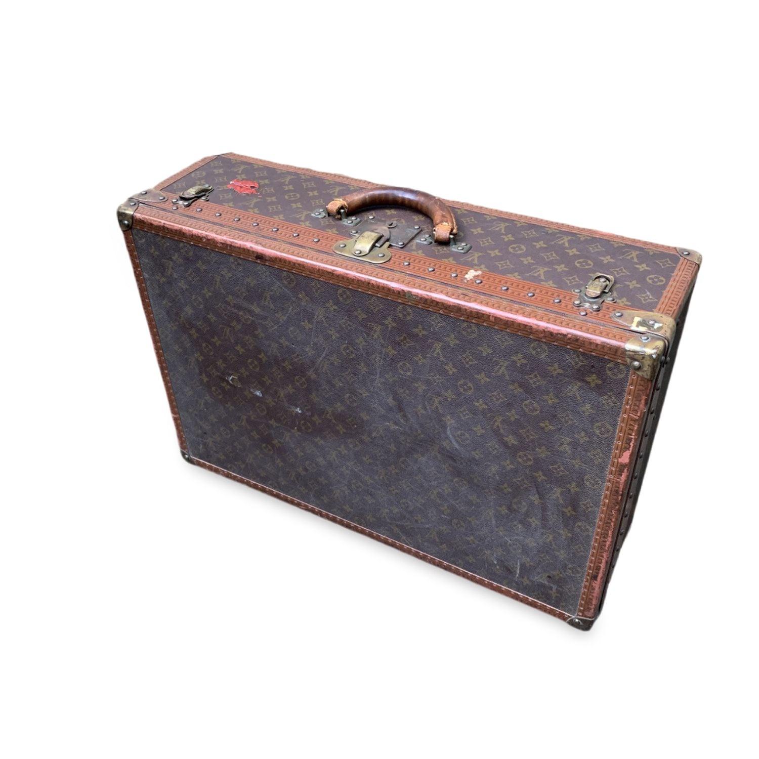 LOUIS VUITTON vintage Monogram Alzer 70 Suitcase, mod. M21226. A part of Louis Vuitton history, ideal for travel or for home or office decor. Monogram canvas with leather trim with embossed.LV logos. Rounded leather handle. Canvas interior.
