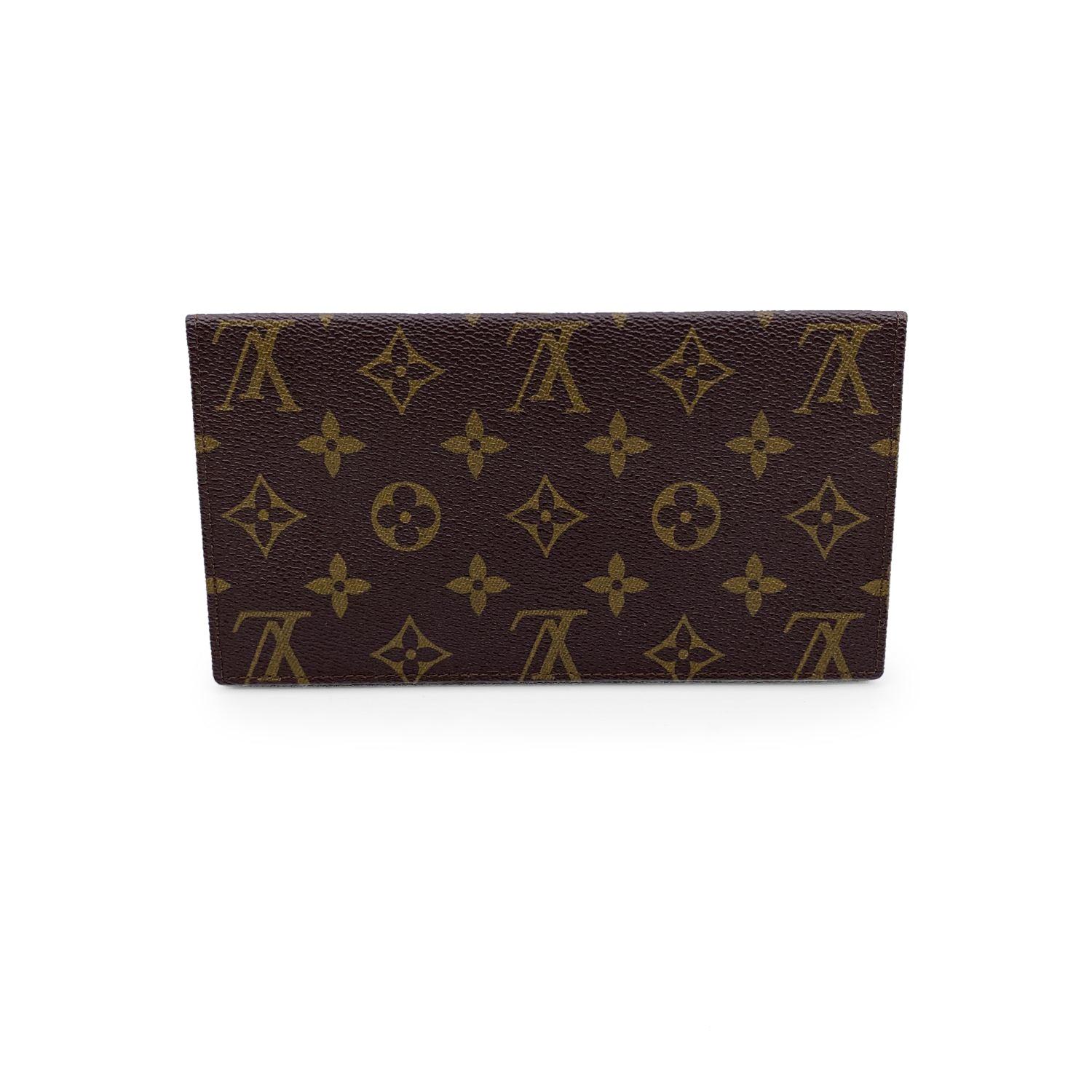 Louis Vuitton Vintage Monogram Canvas Porte Chequier Checkbook holder. Monogram canvas and brown leather inside. 2 open pockets and 1 checkbook slot inside . 'LOUIS VUITTON Paris - made in France' embossed inside. Authenticity serial number engraved