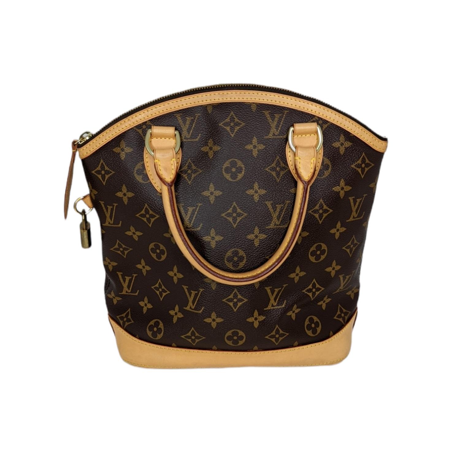 This elegant looking Louis Vuitton Monogram Canvas Vertical Lockit Bag is the tallest of the Lockit collection. It has an ultra-spacious and deep interior with a zip top that secures all your belongings. Now discontinued, this piece is highly sought
