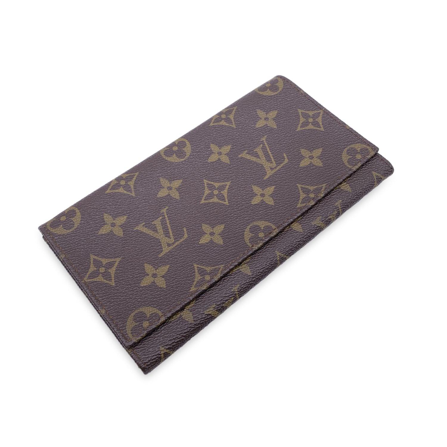 Vintage Louis Vuitton brown monogram canvas Long Bifold Bill Wallet. Flap closure. Leather lining. 1 main compartments inside. 'LOUIS VUITTON Paris - made in France' engraved inside. Details MATERIAL: Cloth COLOR: Brown MODEL: n.a. GENDER: Women