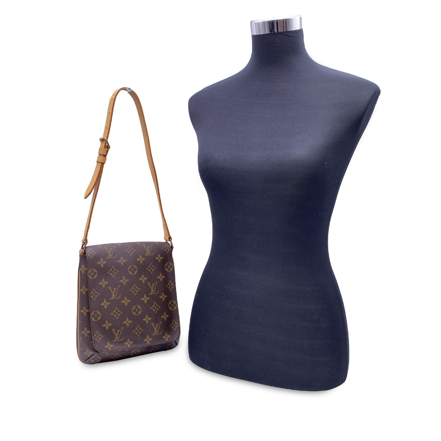 Louis Vuitton 'Musette Salsa'Shoulder Bag, crafted in timeless LV monogram canvas, the bag has golden brass hardware. The exterior features a flap with magnetic button closure. Its interior is lined with soft lining and features 1 open pocket