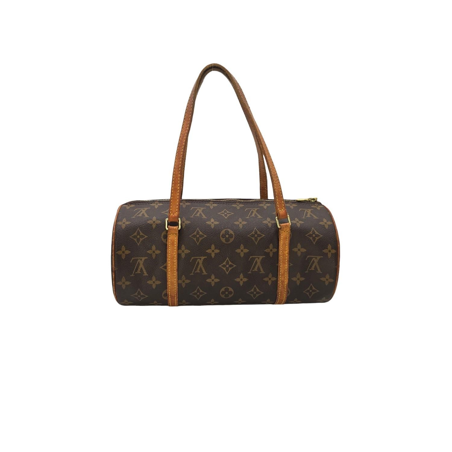 Expertly crafted in the United States by Louis Vuitton, the Vintage Monogram Canvas Papillon 30 Bag is a timeless piece that exudes luxury and sophistication. Made from sturdy monogram coated canvas with cowhide leather trim, this bag features brass