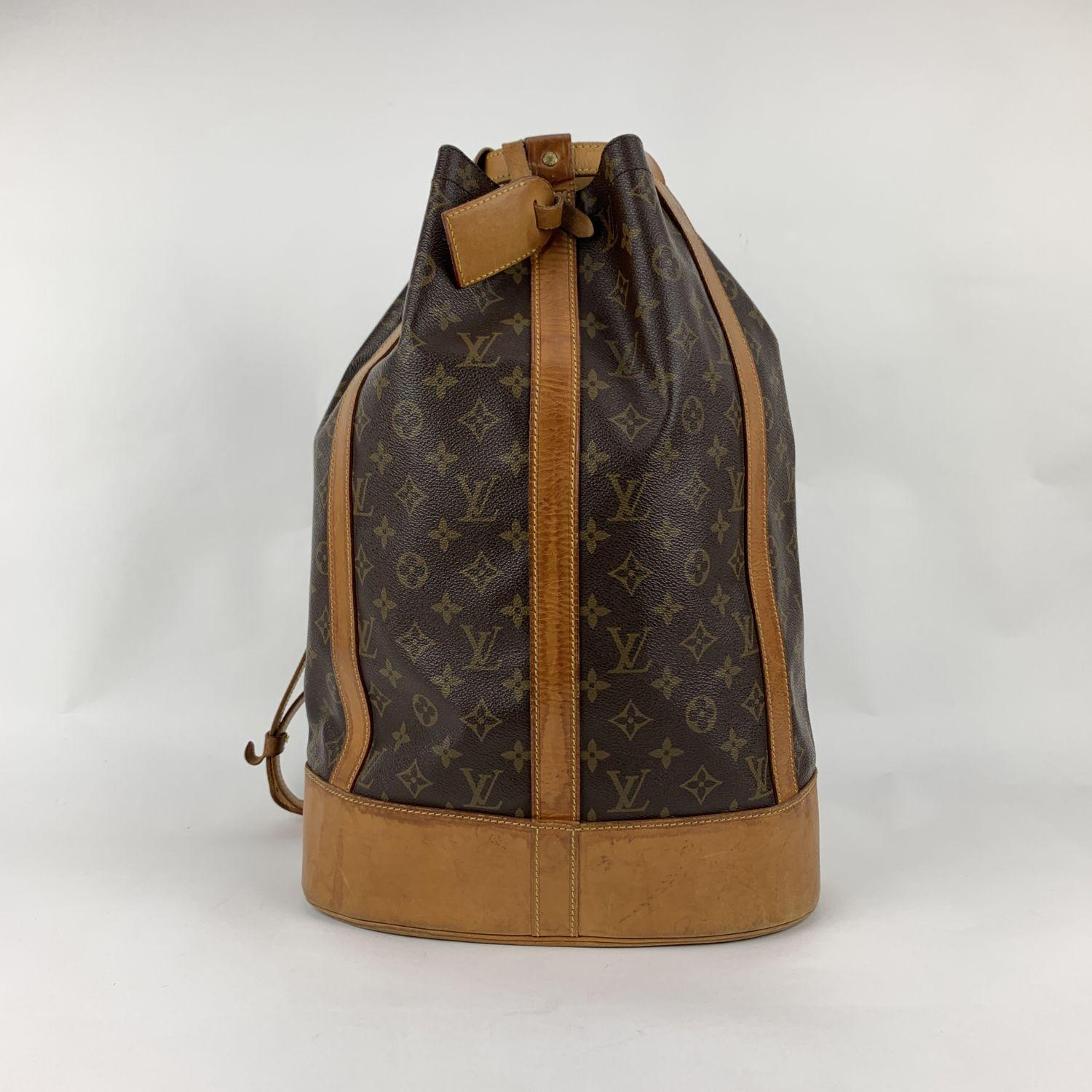 Spacious and sophisticated 'Sac Randonnèe' Shoulder Bag by LOUIS VUITTON, crafted in timeless monogram canvas. This model is discontinued so it is no longer available in stores. The bag features a large main compartment, a removable inner zip pouch