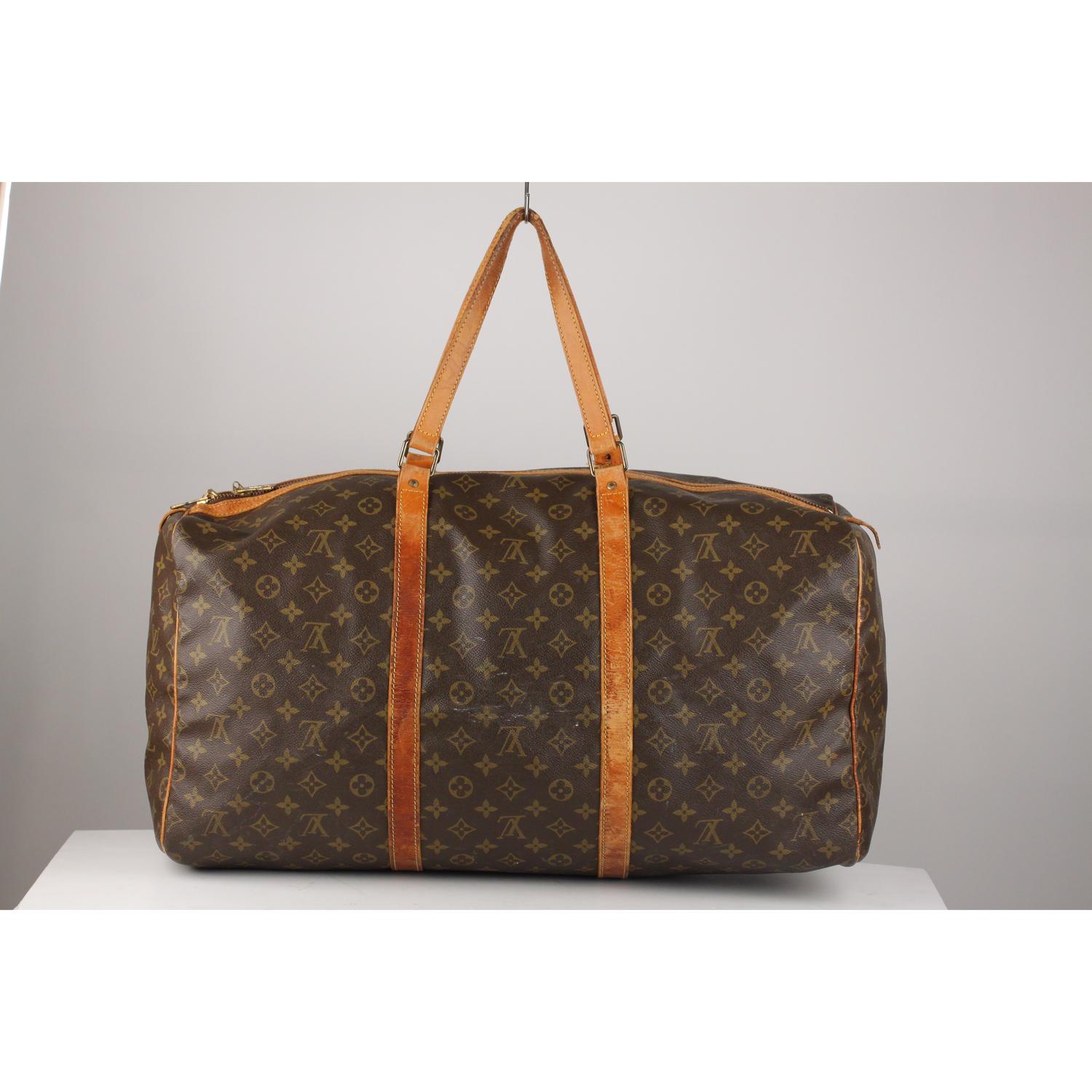 Louis Vuitton classic Monogram Canvas vintage 'Sac Souple 55'. Double zip closure. Double leather handles. Brown fabric lining. 'Louis Vuitton Paris - made in France' engraved on leather piece on the side (with serial number engraved on its reverse,