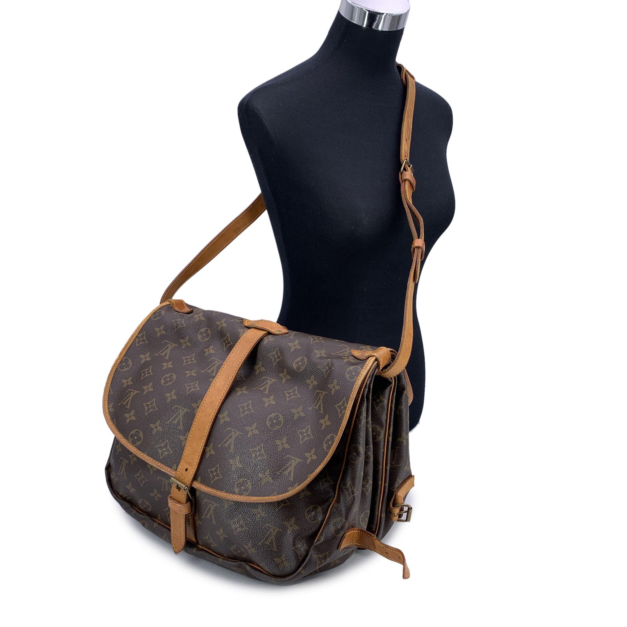 Step into a world of classic Louis Vuitton style with the iconic 'Saumur 35' bag, a true tribute to equestrian design and craftsmanship. Inspired by the saddle bags traditionally used by riders, the Saumur 35 boasts an innovative and functional